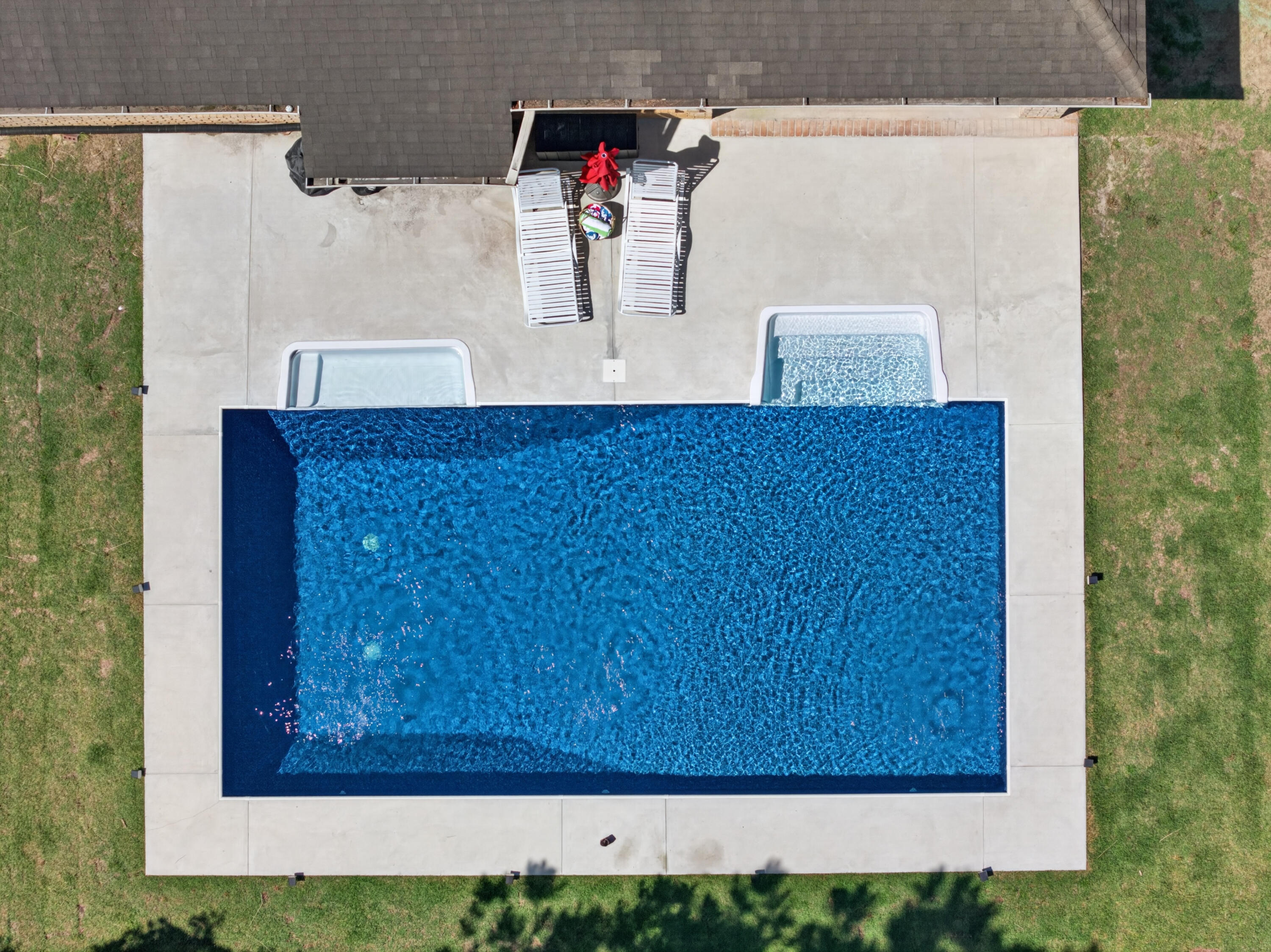 Turning Go Big or Go Home into an address Is what 49 Harmony Way does. This is the kind of home that stops you mid-scroll- bold in size, this 3,750-square-foot residence delivers a combination of polished design, functional space, and outdoor living that includes a new saltwater pool-all within one of Hammock Bay's most intimate and charming neighborhoods.  Harmony way is  a quaint 19-home cul-de-sac where every home backs to the nature preserve, offering a level of privacy and breathing room that is becoming increasingly hard to find. Sitting on .36 acres with an oversized courtyard driveway and side-load garage, the curb appeal immediately sets the tone: substantial, elevated, and anything but cookie-cutter.
Inside, the layout simply works. The open-concept design creates natural flow between the main living spaces while still offering the flexibility that today's families want. Dedicated office? Check. Formal dining room? Absolutely. Bonus craft room? Yes. Massive 26x13 fifth bedroom that could become the ultimate media room, game room, teen retreat, or second living area? You got it. The finish selections strike a balance between timeless and current with luxury vinyl plank flooring, granite countertops throughout, crown molding accents, generous storage, and spacious rooms.
Then there's the backyard -The in ground saltwater pool, covered lanai, privacy fencing, preserve views, lush hydoseeded lawn, and additional storage shed create an outdoor setup designed for everything from laid-back evenings to full-scale entertaining. This isn't just a backyard... it's your own private escape.
And life in Hammock Bay? That's an entirely different level of living. More than a neighborhood, it's a full lifestyle experience designed around connection, and convenience. Residents enjoy:
-Three beautifully designed clubhouses, including multiple zero-entry resort-style pools
-State-of-the-art fitness center
-Tennis, basketball, and pickleball courts
-Miles of walking and jogging trails woven throughout the community
-Community General Store, green event spaces, playgrounds, and dog parks
-Dock overlooking the bay
-Community events and seasonal markets that actually make neighbors feel like neighbors!
Just minutes from the white-sand beaches of 30A, South Walton dining, boating, and shopping, 49 Harmony Way delivers the space families want,  and the lifestyle everyone's chasing. Big on personality. Big on functionality. Big on Memories made! Call for a private tour today.