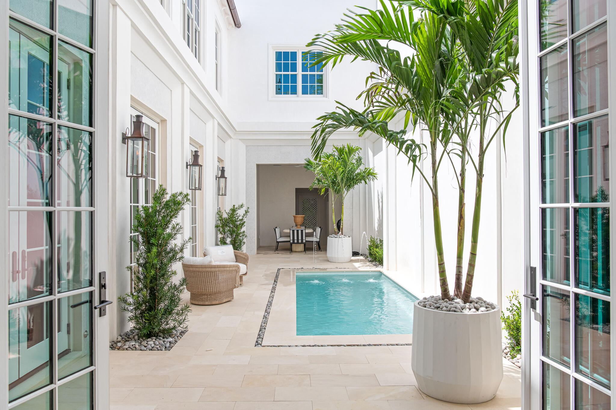 Forever Gulf views, an ideal location just moments from the Alys Beach private Beach Club, and 5,910 square feet of impeccably designed living space make 185 Elbow Beach Road a rare opportunity to own one of Alys Beach's premier newly constructed residences.  

This custom home pairs exceptional craftsmanship with timeless coastal architecture by Chancey Design. A grand entry foyer opens to a private courtyard centered around a resort-style pool, creating an effortless connection between indoor and outdoor living. The expansive first-floor living, dining, and kitchen spaces are refined by 13-foot venetian plastered ceilings, pecky cypress beams, and thoughtfully selected luxury fixtures and finishes throughout. A covered loggia with an outdoor kitchen and dining area overlooks the courtyard pool, providing an ideal setting for entertaining, while the oversized two-car garage offers flexibility to accommodate car lifts if desired. 

The second level is designed with family and guests in mind, featuring four spacious king bed guest suites each with generous closets, along with two versatile bonus rooms, an additional living area, and a well-appointed laundry room. Occupying the entire third floor, the primary suite serves as a private sanctuary complete with its own rooftop terrace overlooking the iconic rooftops of Alys Beach. An additional expansive shared rooftop terrace looks south to capture sweeping Gulf views, spectacular sunsets, and cooling coastal breezes. An elevator provides convenient access to every level, including the rooftop.

Offered fully furnished, with interiors curated by Chancey Interior Design, this turnkey residence is ready to be enjoyed from day one, delivering an exceptional blend of luxury, comfort, and one of the most sought-after locations in Alys Beach.