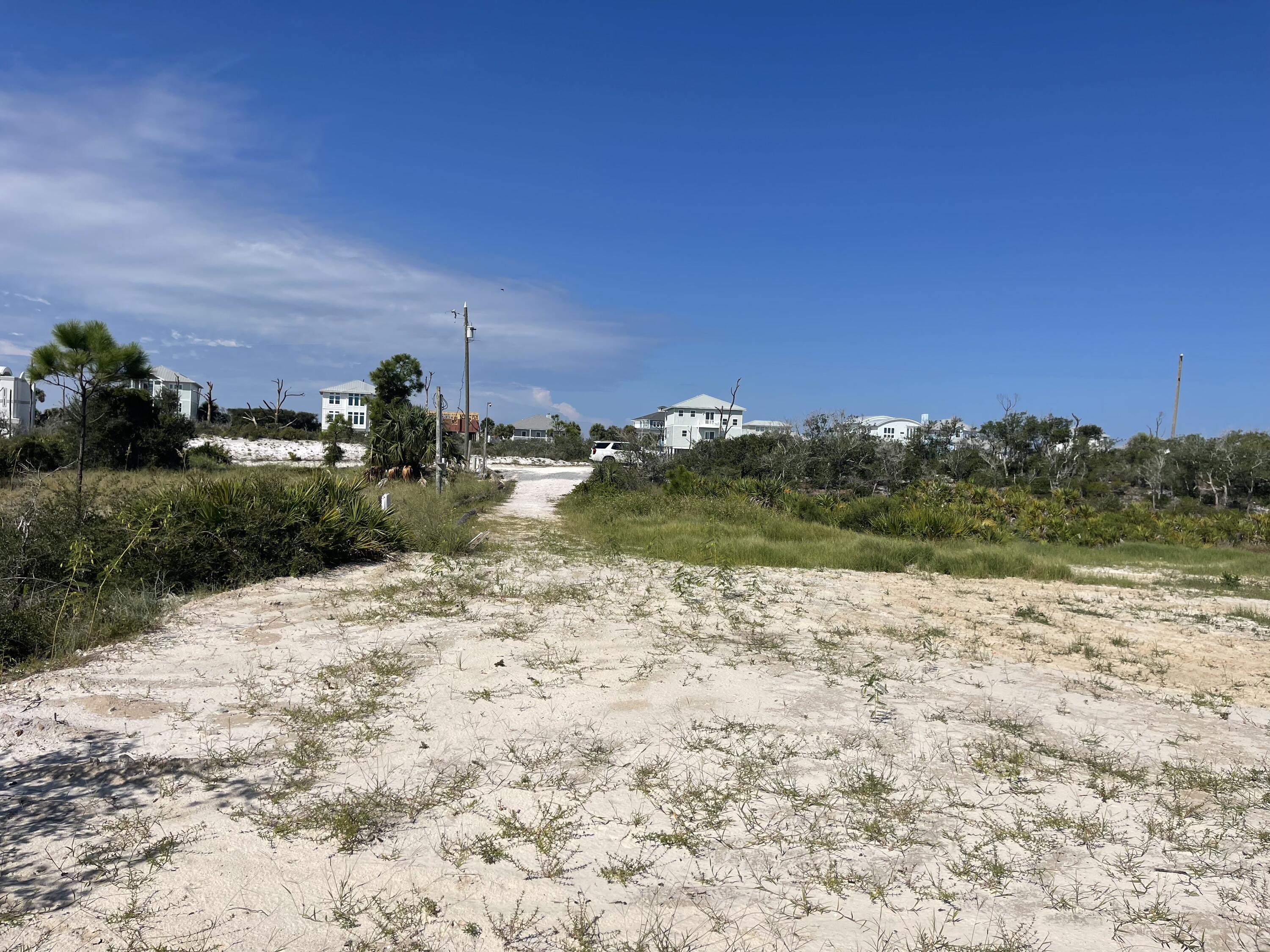 NORTH CAPE SAN BLAS BUILDING SITE WITH POSSIBLE OWNER FINANCING!!! Located less than 80' from the state park with NO HOA or HOA FEES! Dedicated beach access with a boardwalk/dune walkover that meanders between beautiful old growth coastal oaks and palms. This elevated, platted, and vested lot at The Bluffs at Secluded Dunes affords views of the Gulf of Mexico to the west, a 4.5 acre wetland area to the rear, St Joseph State Park views to the north. Possible views of the bay as well depending upon elevation of home. Water tap already paid for and installed, city sewer available, electricity already on site. Site already is cleared and prepped with driveway installed. Get back to nature today! All dimensions were obtained per the recorded plat or the GulfPA site. Please verify if important