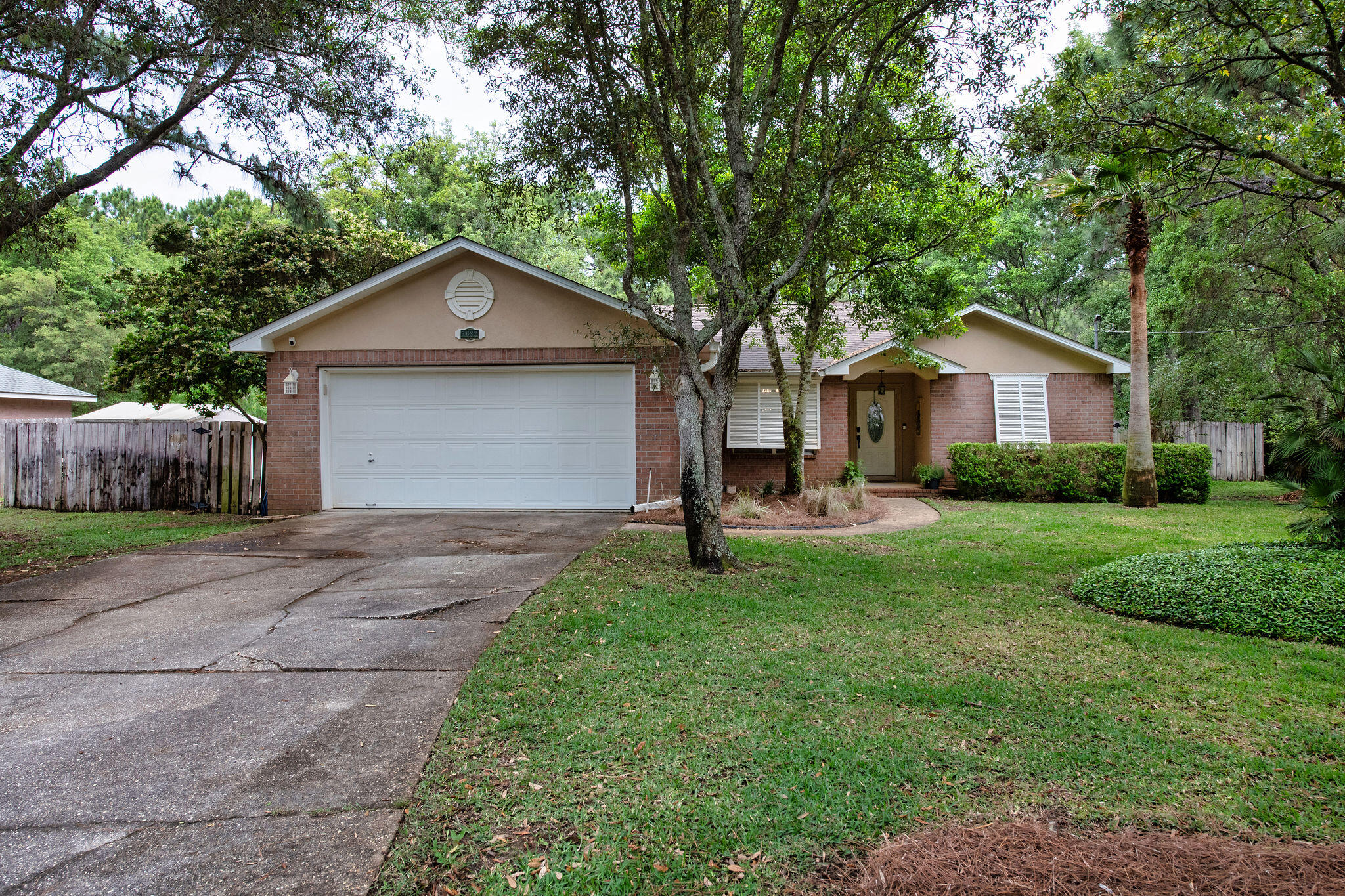 Welcome Home to 7682 Manatee St, Navarre, FL 32566

Nestled in the sought-after Holley by the Sea community, this charming 3-bedroom, 2-bathroom home delivers the perfect blend of comfort and space. With 1,490 square feet of thoughtfully designed living space, every corner of this residence feels inviting and intentional.

Inside, discover a smart split floor plan complemented by soaring vaulted ceilings that flood the living room and dining area with natural light. The kitchen offers plenty of storage space for the home cook, while upgraded luxury vinyl plank flooring flows seamlessly throughout the main living areas. The generous primary suite is a true retreat, featuring tiled floors, a super spacious en suite bathroom, and a large closet that makes organization effortless. Recent updates deliver true peace of mind. A new roof and hot water heater were installed in 2023, along with a new stove and dishwasher. The refrigerator was replaced in 2025, ensuring the home's major systems and appliances are fresh and reliable for years to come.

Now, let's talk about what truly sets this property apart -- the incredible outdoor space. Situated on a sprawling 0.43-acre lot, this home gives you room to breathe, relax, and entertain without limits. Unwind on the screened porch during warm Navarre evenings or gather around the outdoor fire pit under the stars for unforgettable moments with loved ones and friends.

The location is equally impressive. Everyday conveniences like Walmart Neighborhood Market are just minutes away, while Navarre Park offers nearby recreation and green space for everyone to enjoy.

Whether you're seeking a peaceful coastal lifestyle or a spacious retreat with plenty of room, this Navarre gem checks every box. Schedule your showing today!