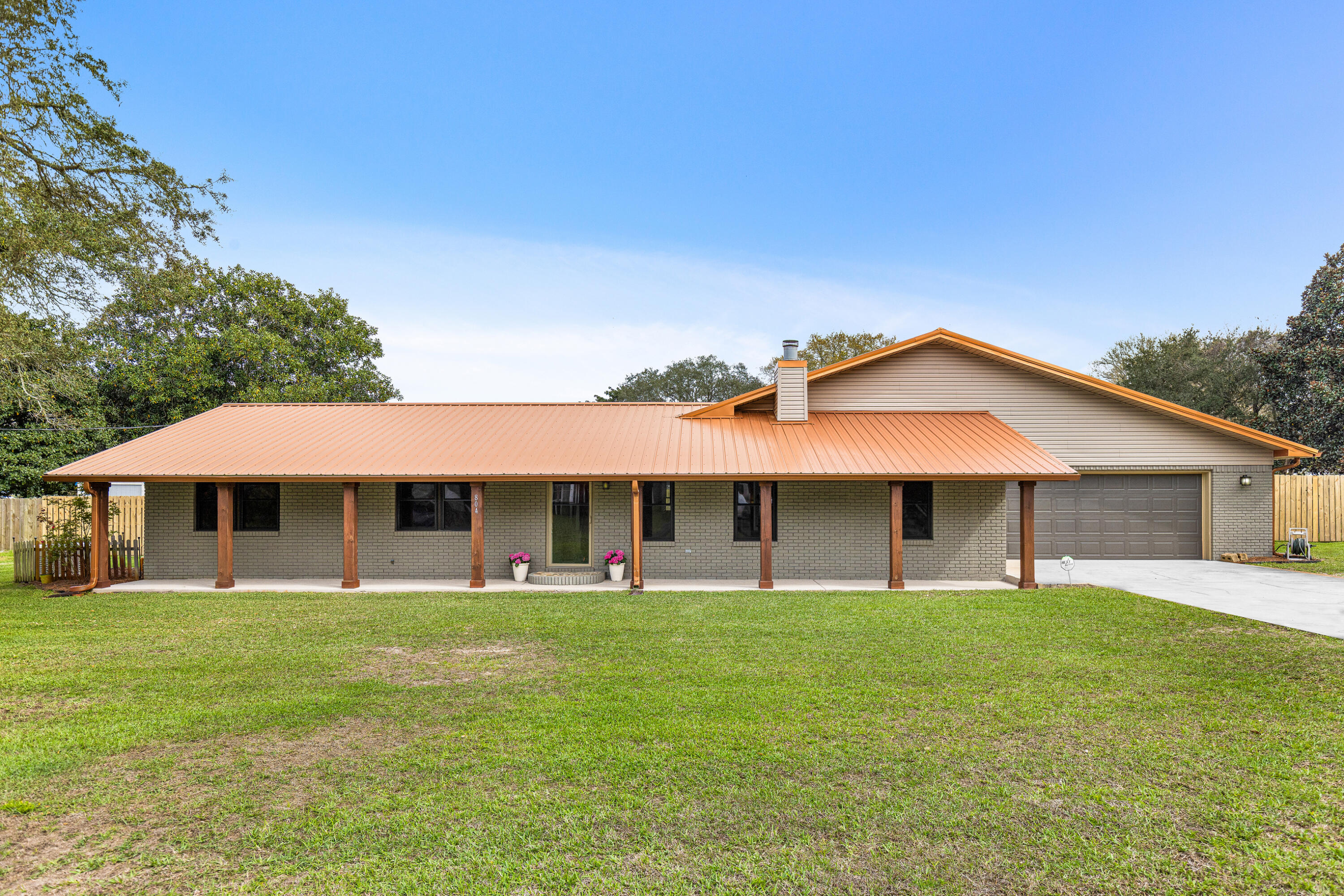 Amazing 5-bedroom brick home on a rare 0.70-acre lot in the heart of Destin with no HOA, offering space, privacy, and modern updates. This thoughtfully updated residence boasts a remodeled open kitchen with granite countertops & stainless steel appliances. No carpet throughout, just durable tile & luxury vinyl plank flooring, paired with fresh interior paint, creates a move-in-ready, clean aesthetic. This 3,508 sq ft home is designed for comfort, security, and peace of mind, with a new metal roof (2022), impact windows, and a Generac 24 kW whole-house generator. Additionally, the home is in Flood Zone X, meaning flood insurance is not required. The backyard retreat is designed for entertaining, complete with a heated pool, hot tub, grilling station, gazebo for outdoor dining, and an expansive pool deck surrounded by a large fenced yard for ultimate privacy. 

Inside, enjoy three cozy fireplaces, in the living room, den, and primary suite, along with updated bathrooms with new vanities and showers. A large front porch welcomes guests, and the 2-car garage with additional driveway parking for 4 vehicles ensures ample space for family and visitors.

Lifestyle and location are unbeatable! From this home, Joe's Bayou is less then 2 miles away, where you can launch your boat and be at Crab Island in just minutes, making spontaneous water adventures quick and easy. Additional nearby Destin attractions include HarborWalk Village, Norriego Point, Captain Leonard Destin Park, and Mattie Kelly Recreation Area and Pier. Daily conveniences like Publix and dining favorites such as McGuire's Irish Pub, Boshamps, Harbor Docks, and Marina Café are all within 5 miles from the home. 

This home offers a rare combination of a large, private lot, modern updates, and unbeatable access to Destin's waterways and attractions, a true opportunity to enjoy the ultimate Destin lifestyle!