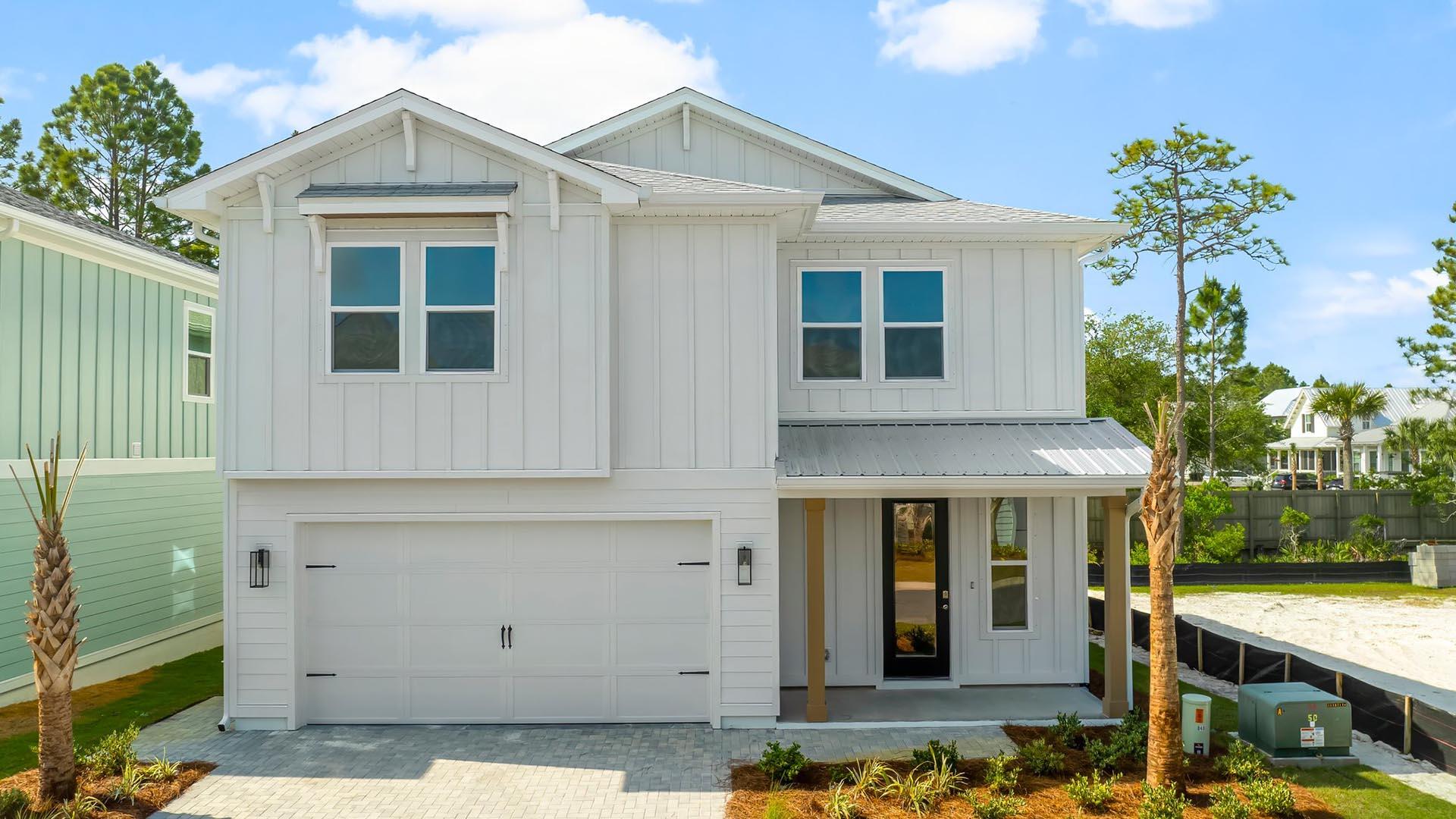 This stunning two-story home hosts 2,800 square feet of elegant living space with an abundance of natural light flowing from windows and illuminating the luxurious interior features. Entertain with ease in the open kitchen complete with bar seating, elegant quartz countertops, bright ivory cabinetry, a farmhouse sink, and large corner pantry. The gourmet kitchen has been designed with KitchenAid appliances including a built-in wall oven and microwave as well as a full refrigerator and stove.