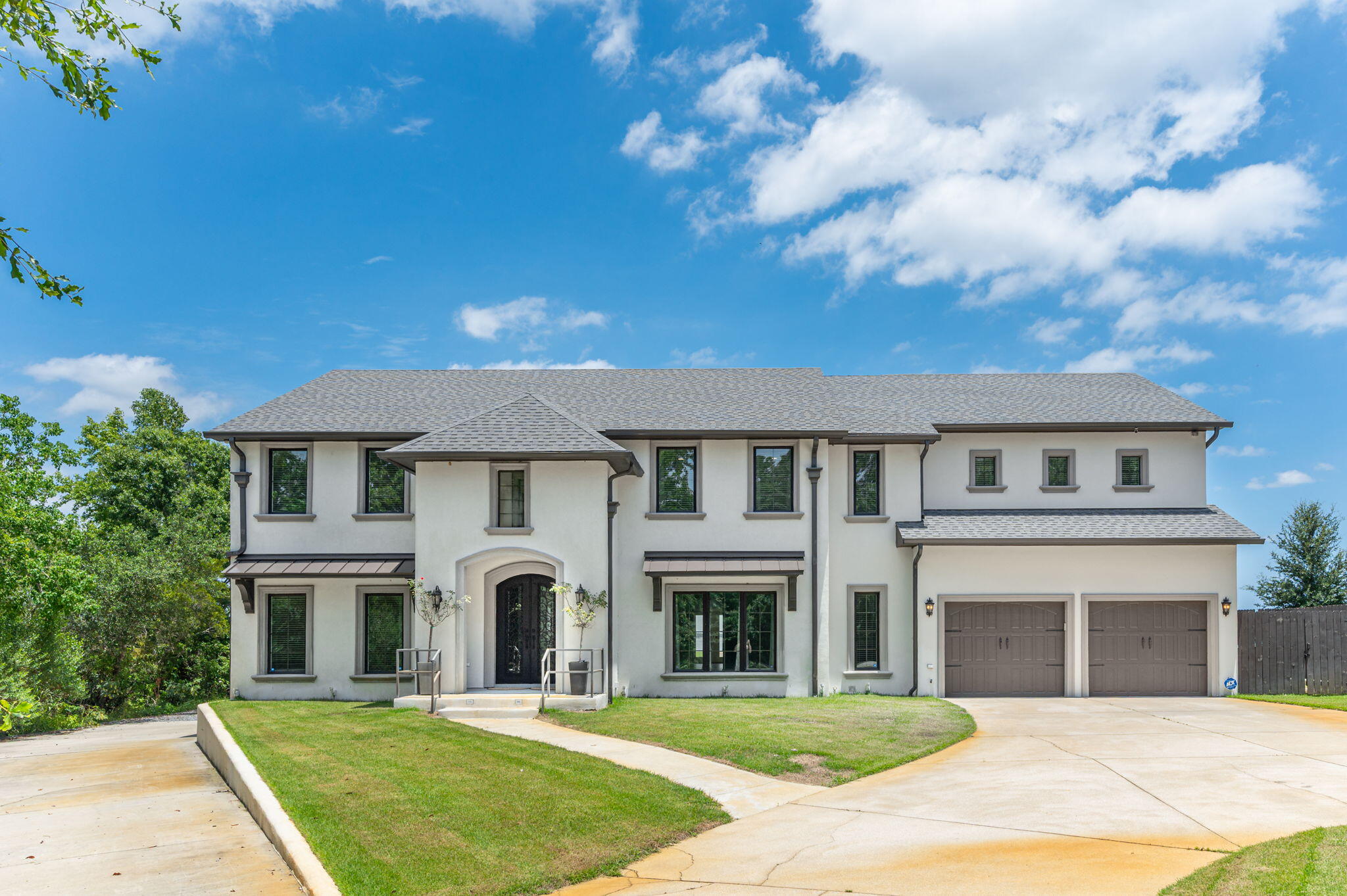 Welcome to an exceptional bayfront retreat where luxury, comfort, and waterfront living come together. Set along your own private stretch of shoreline with a sandy beach and private boat dock, this beautifully renovated five-bedroom estate offers an exceptional blend of timeless design and effortless waterfront living.

As you step through the stunning double iron hurricane-rated front doors, expansive bay views greet you the moment you enter. The entire back of the home is lined with windows, creating a light-filled living space where the water is always front and center. Designed for both everyday living and entertaining, the open-concept floor plan centers around a chef's kitchen featuring stainless steel appliances, an induction cooktop, double ovens, a warming drawer, generous prep space, and custom cabinetry. Just beyond, a dedicated theater room with elevated seating, projection, and surround sound creates the ultimate space for movie nights, game days, or gathering with family and friends.

Upstairs, the spacious primary suite offers a peaceful retreat with breathtaking water views, a spa-inspired bath featuring a soaking tub, an oversized tiled shower with multiple body sprays, and two walk-in closets. Four additional bedrooms, each with their own walk-in closet, provide plenty of space for family and guests. An expansive bonus room currently serves as a home gym, while an additional flex room offers the perfect space for a home office, playroom, or hobby room. Laundry rooms on both levels add everyday convenience.

The oversized garage includes a separate workshop, additional storage, and a golf cart door for easy access to all your waterfront gear. Outside, multiple covered entertaining spaces overlook the bay, creating the perfect setting for morning coffee, sunset dinners, or simply relaxing as dolphins swim by. Spend the afternoon on your private sandy beach, head out on the water from your private dock, and enjoy the kind of waterfront lifestyle most people only dream about. Completely renovated from the studs out in 2023 and equipped with hurricane impact-rated windows and doors, this extraordinary home offers the rare combination of luxury, functionality, and an unmatched bayfront setting.

**Boat lift conveys in as-is condition. Boat lift is non-functional and was not operational prior to the sellers' purchase of the property. Home gym equipment is being left as well as the theater system and chairs. Buyer to verify all measurements and information for accuracy.