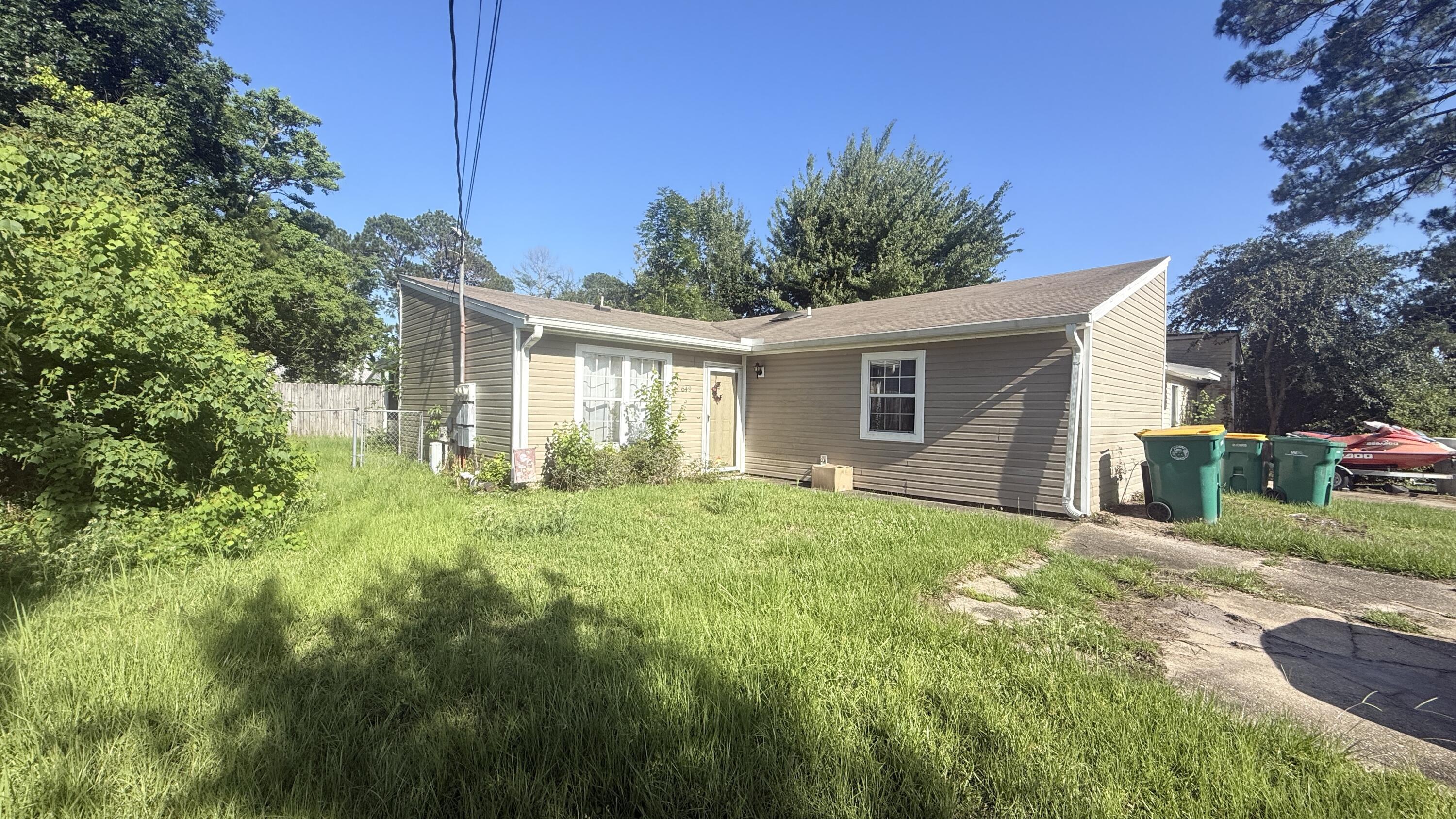 INVESTMENT or FLIP OPPORTUNITY *CASH ONLY* END UNIT, 2/2 Vinyl Townhome with Private Yard and 4 Parking Spaces!  Open Floor plan - Large Living room/Dining that open to the Kitchen. Great Location  - close to Beaches, Bases and Shopping!  NEST Programmable Thermostat.  All Tile Flooring (NO CARPET!) Kitchen has a Large Breakfast Bar and functioning appliances including Refrigerator with Ice Maker, a Dishwasher and a Glass top Range with Self-Cleaning Oven.  The Built in Microwave leaves plenty of extra countertop space.  Each Bedroom has a Double Closet and a Private, Full Bath. Outside, there is a Screened Porch, Laundry room with storage and a Large, fenced Back Yard.  Shed is in disrepair and has no value.  Hose Bibb recently replaced. There is No Homeowners Association.  Home needs a deep cleaning.  Water service is off but there are no known leaks.  Buyer will need to turn on water for inspections. Ceiling damage in screened porch but none visible in home.  Roof needs to be replaced. Kitchen cabinets are nice. Tiled Counter top needs trim pieces. Front Door threshold needs repair and there are a few cracked tiles at the entry - Majority of flooring is in very good condition.  MAKE YOUR BEST OFFER. SELLER DESIRES A FAST CLOSING. Roof Replaced in 2011, HVAC is 2009; Water Heater is 2012.