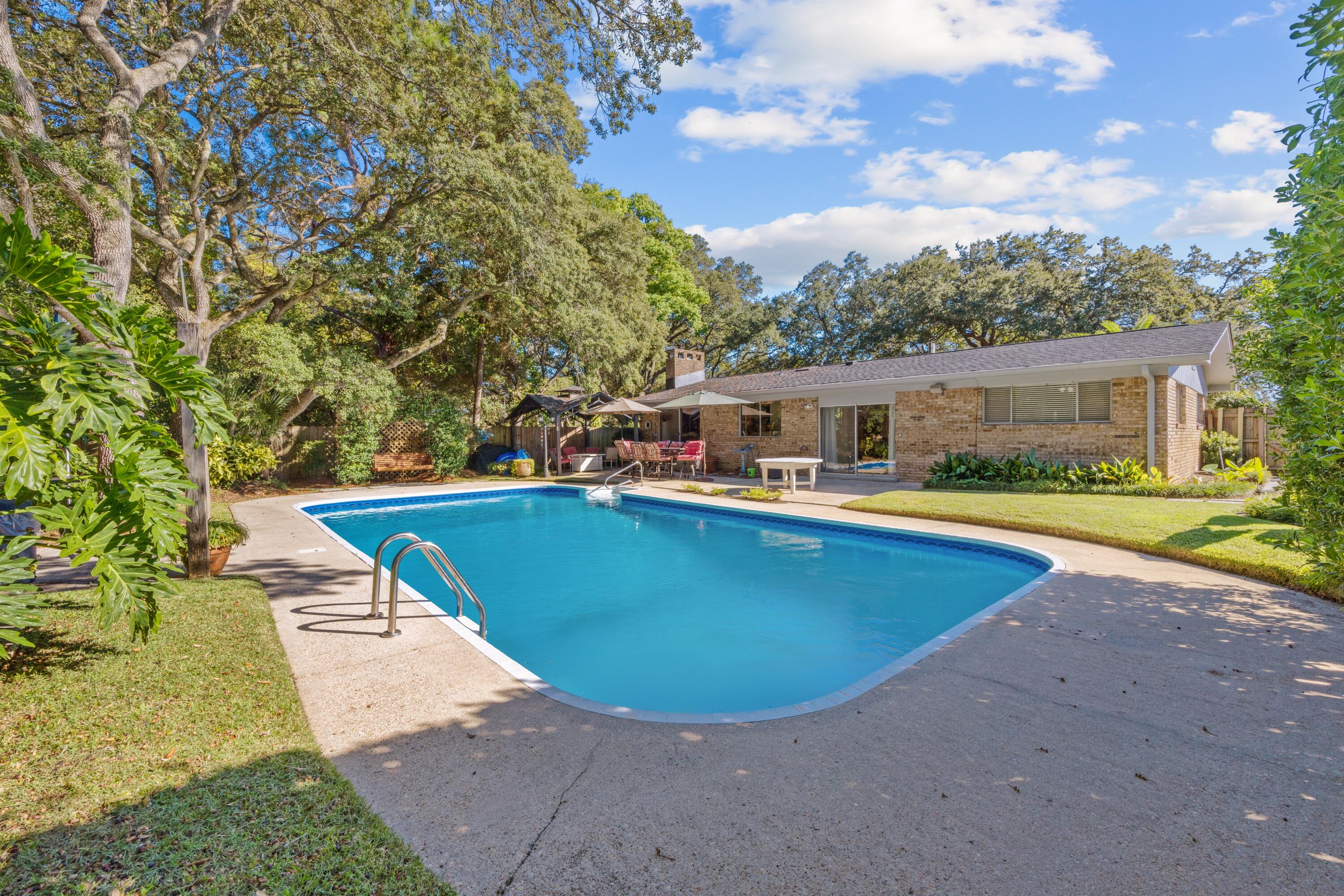 Stylish, Move-In Ready Home with Pool & Prime Fort Walton Beach Location!
Discover the perfect blend of comfort, style, and functionality in this beautifully maintained Fort Walton Beach home. With a new roof (2023) and water heater (2020), this move-in ready property is packed with updates that make life easy and enjoyable. The split-bedroom floorplan boasts tile floors throughout, a spacious living room with built-in surround sound, and a separate family room both opening through sliding glass doors to your patio and sparkling in-ground pool, perfect for entertaining or relaxing. The galley-style kitchen shines with a breakfast bar, tile backsplash, crown molding, recessed lighting, and a skylight that floods the space with natural light. The updated secondary bathroom features a sleek tiled shower with glass doors, while the primary suite offers his-and-hers closets, a double vanity, separate shower and jacuzzi tub, and built-in storage for ultimate organization. Additional perks include a two-car garage with backyard access, convenient laundry closet, and mature landscaping front and back. Tucked on a quiet end-corner lot, enjoy added privacy and minimal traffic. Centrally located in Fort Walton Beach, you're just minutes from shopping, dining, and entertainment, this home truly offers the ideal mix of updates, comfort, and location.