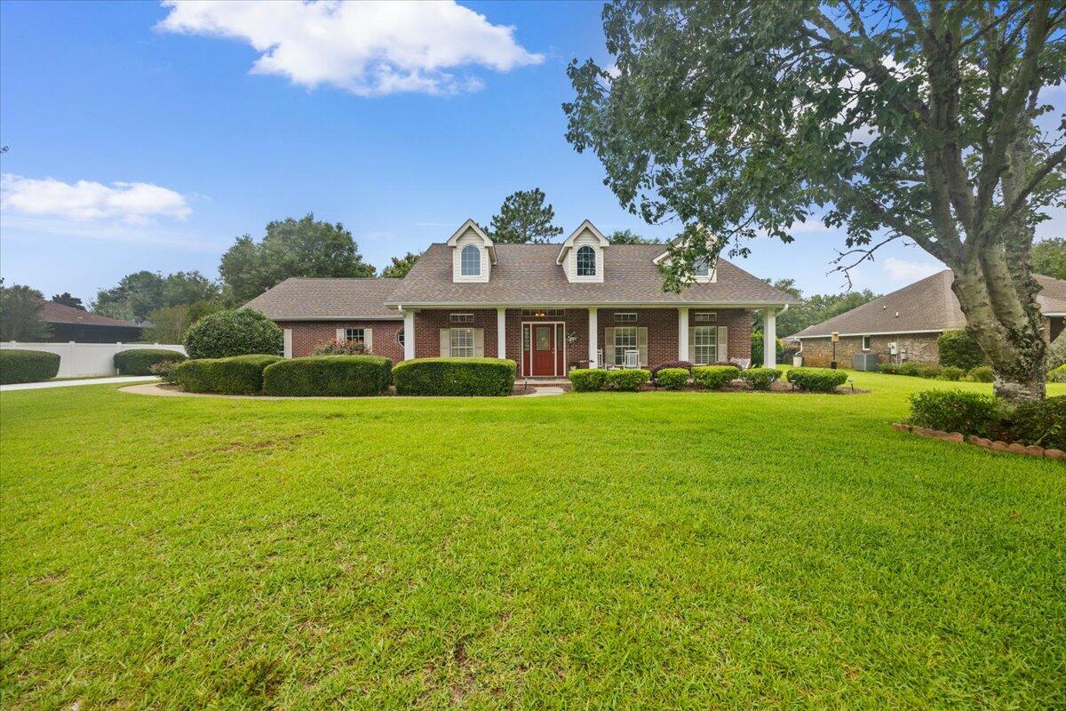 Welcome to 2555 Holley Place - an impeccably maintained home tucked inside the sought-after Holley by the Sea community in Navarre. From the moment you arrive, the beautifully landscaped yard and inviting curb appeal set the tone for what's inside. Step through the front door and you'll notice updated flooring (2024) and refined finishes that add warmth and character throughout. The spacious layout features thoughtful details like built-in shelving surrounding a functional propane gas fireplace. The kitchen blends functionality with charm, offering features such as glass-front cabinetry, updated range (2025), and counterspace for days--perfect for everyday living or entertaining. 

Just off the kitchen, the family room centers around a cozy fireplace and opens seamlessly to the backyard through stunning French doors.

Outdoors is where this home truly shines. The expansive ~500 sq ft screened back porch creates the perfect nature retreat to gather around and watch and listen to wildlife in the expansive backyard.  Whether you're enjoying quiet mornings or hosting friends, this space invites you to slow down and enjoy the Florida lifestyle. 

Living in Holley by the Sea means access to one of the area's most impressive recreation centers, offering pools, fitness facilities, Pickleball and tennis courts, and more--just minutes from your doorstep.  You're also conveniently located near local military installations (NAS Pensacola, Whiting Field, Hurlburt Field, and Eglin AFB) making commuting simple, while the sugar-white sands and emerald waters of Navarre Beach are just a short drive away.

If you've been looking for a well-cared-for home with welcoming charm, thoughtful upgrades, and a location that connects you to both everyday conveniences and the best of the Emerald Coast, this one is worth a closer look.