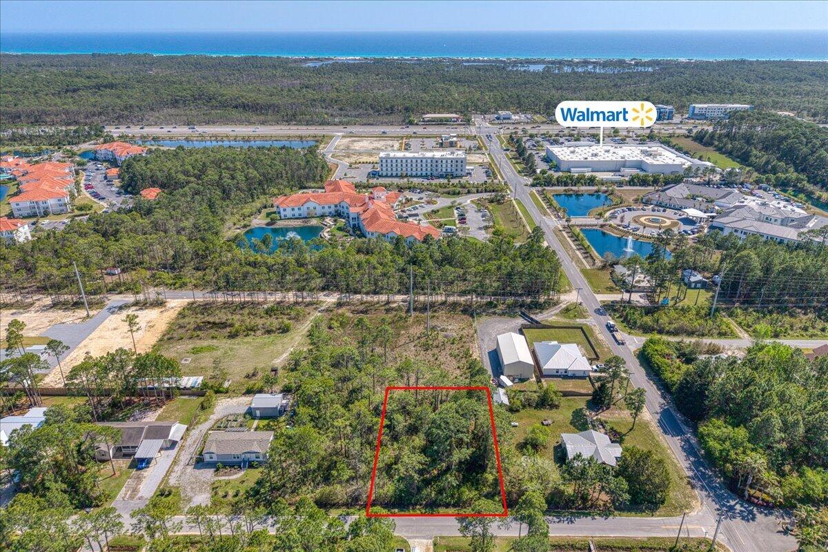 Discover the opportunity to build your dream home on this .321-acre vacant lot in Santa Rosa Plantation with NO HOA restrictions! Situated in an X flood zone. Nestled on quiet Starlight Lane, this property offers a peaceful setting while being close to everything the area has to offer. Enjoy being just minutes from Topsail Hill Preserve State Park, the iconic Donut Hole, and the upscale shopping and dining of Grand Boulevard! Everyday conveniences are right at your fingertips.Walmart is within walking distance and just a short drive away is Sacred Heart Hospital, Publix, multiple golf courses, and a wide variety of restaurants. With easy access to Scenic 30A, you're only moments from the stunning white sand beaches and emerald waters that make this area so desirable.  Whether you're lookin g to create a primary residence, second home, or investment property, this centrally located lot presents a rare opportunity to own land in one in beautiful Santa Rosa Beach!