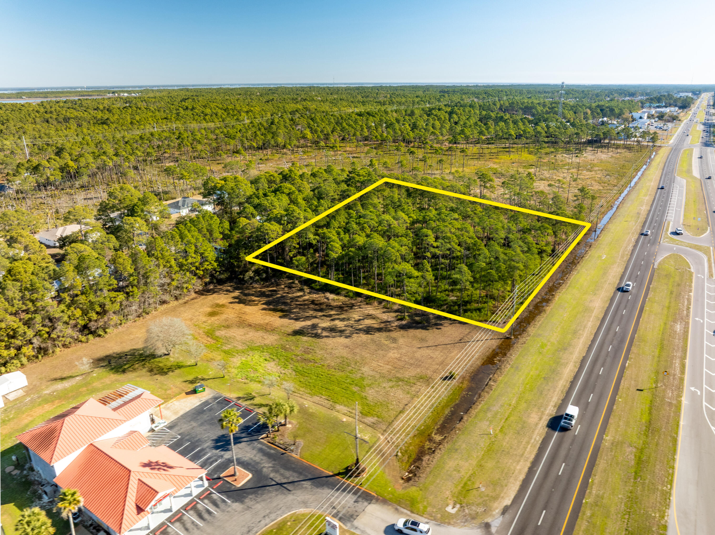 NEW LISTING of Prime Commercial Vacant Land in Santa Rosa Beach, Florida! This ±2,118-acre site spans ±279' along Highway 98, adjacent to Shrimpers Seafood to the West, and adjacent to the East is ±145 acres of State Forest. Zoned Village Mixed Use, this acreage offers a multitude of viable end-uses. The current conceptual site plan illustrates a medical facility and a separate pharmacy building with a drive-thru. The civil engineering for ingress and egress is superb, offering a deceleration lane and median cross-cut for the benefit of Eastward-bound traffic. Please inquire for further details.