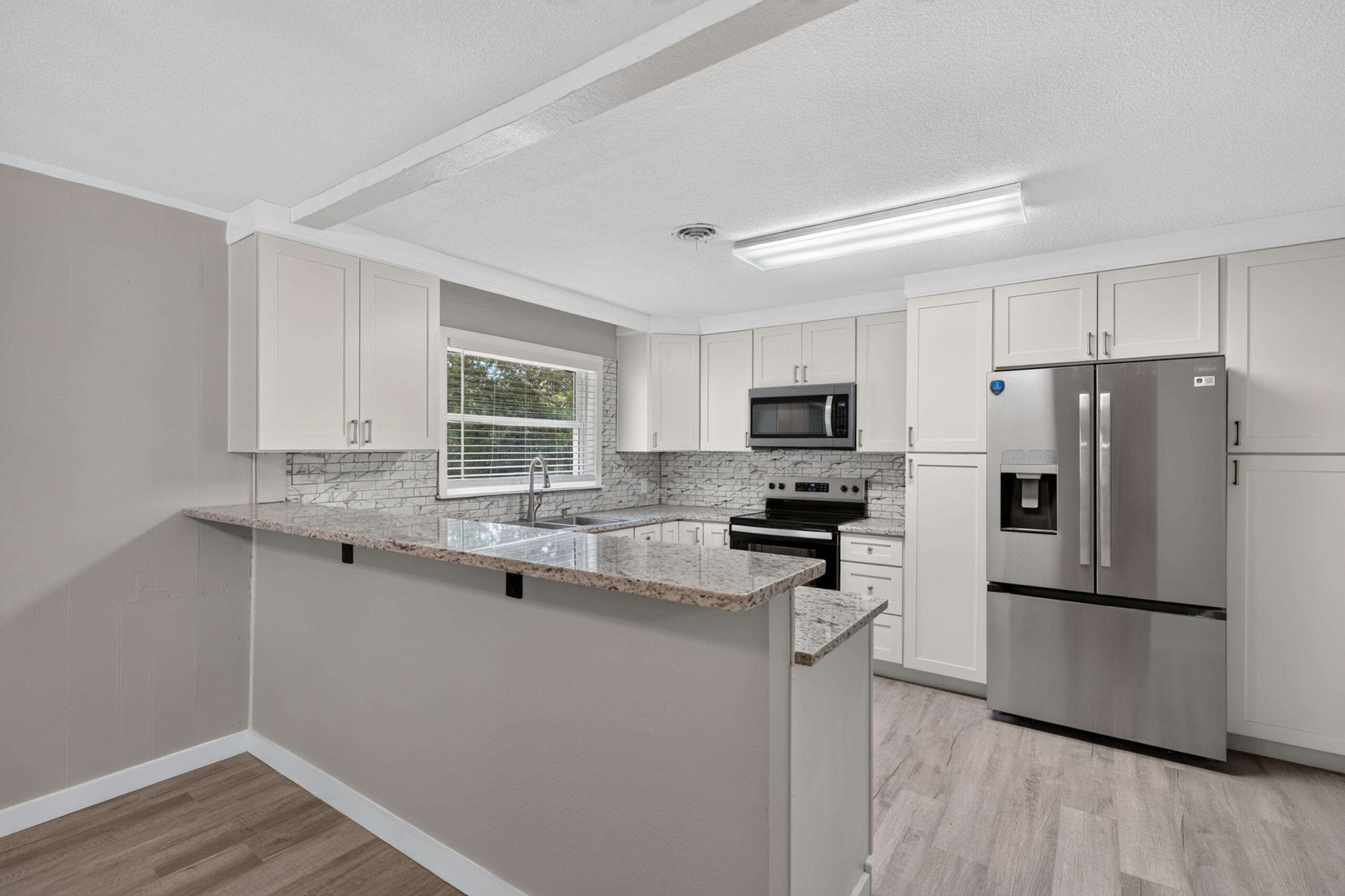 Beautifully renovated 4-bedroom, 2-bath brick home offering 1,917 square feet of move-in-ready living space on a spacious 0.48-acre corner lot. Thoughtfully updated throughout, this home features a brand-new kitchen with granite countertops, new cabinetry, and all-new stainless steel appliances (2026), creating the perfect space for cooking and entertaining.

The inviting living room centers around a cozy fireplace, adding warmth and charm for relaxing evenings at home. Recent major updates include new 50 gallon water heater (2026), a newer roof and HVAC system (2022), providing added peace of mind.

Step outside to enjoy the large, fully fenced backyard with plenty of room for entertaining, gardening, pets, or play. A storage shed offers additional space for tools and outdoor equipment.

Conveniently located near shopping, dining, schools, and Whiting Field Naval Air Station, this beautifully updated home combines modern finishes, functional living spaces, and an excellent location. Don't miss this fantastic opportunity--schedule your private showing today!