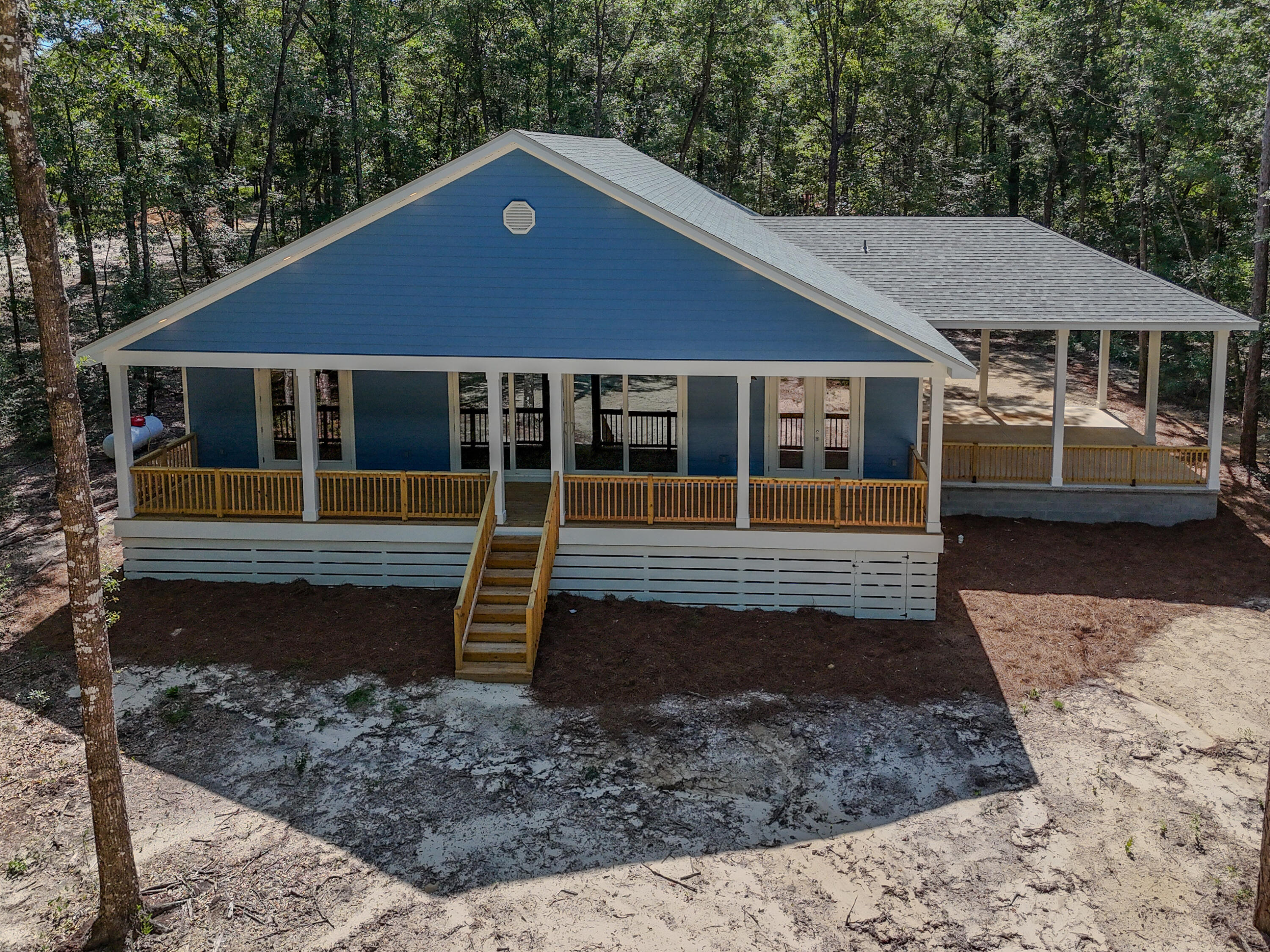 Welcome to your brand-new waterfront home on Holly Lake. This thoughtfully designed home offers a private dock, peaceful wooded surroundings, and direct lake access for fishing, kayaking, or simply enjoying the view. Inside, you'll find an open floor plan with 10-foot ceilings, cathedral ceilings, custom cabinetry, tiled showers, and tongue-and-groove porch ceilings. Additional upgrades include a hot water recirculation system for added comfort and convenience. Whether you're looking for a full-time residence or a weekend retreat, this move-in-ready home offers the perfect blend of quality craftsmanship and waterfront living, just minutes from DeFuniak Springs.