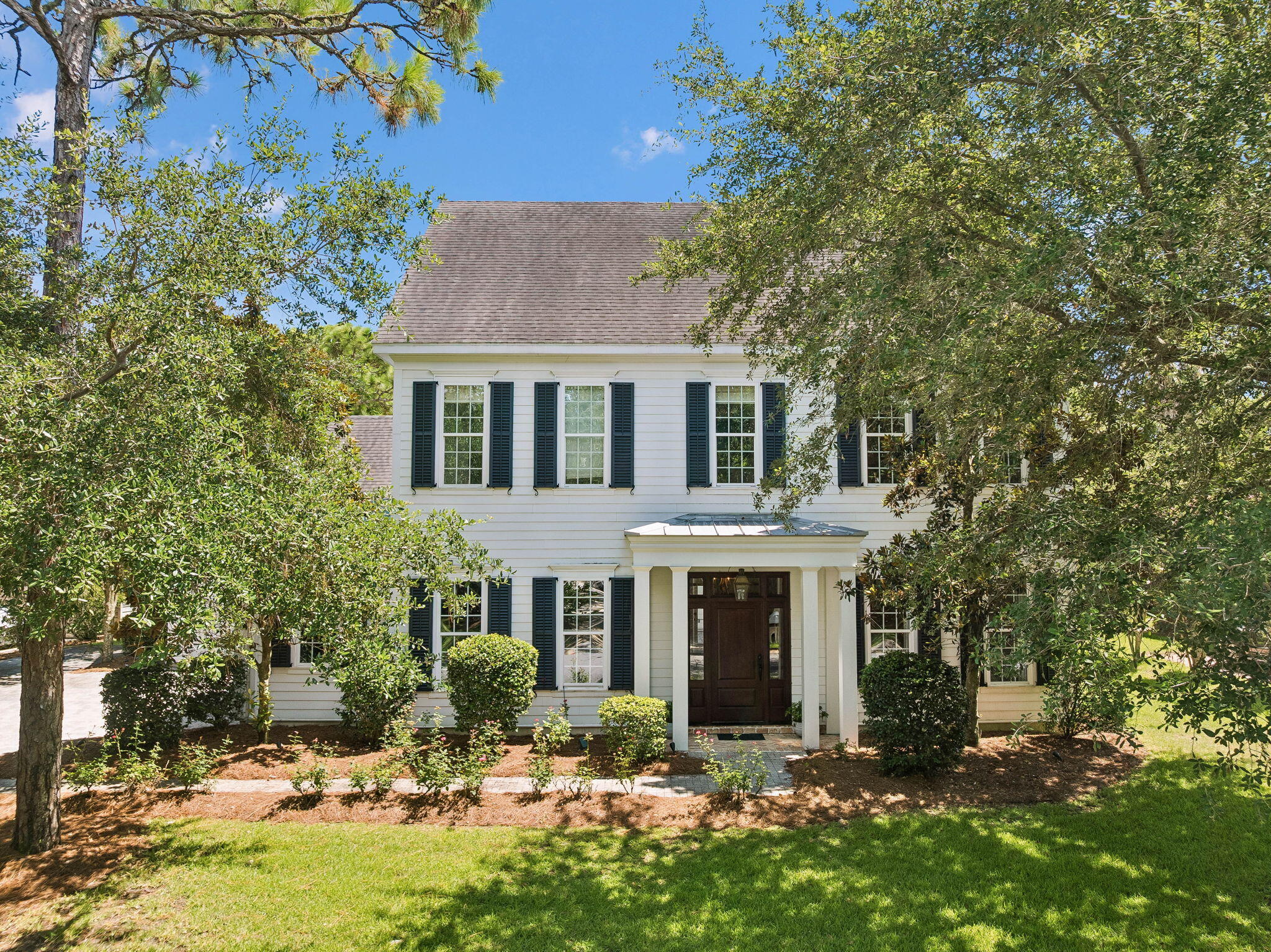 Beautiful custom home located in the gated waterfront community of Botany Bayou, offering privacy, timeless architecture, and an exceptional Santa Rosa Beach location just minutes from 30A, Grand Boulevard, Sacred Heart Hospital, and Choctawhatchee Bay. Backing to a protected wooded preserve, this home features soaring ceilings, extensive millwork, abundant natural light, and spacious living areas designed for everyday comfort and entertaining. The gourmet kitchen opens seamlessly to the great room, while the luxurious primary suite offers a spa-like bath with dual vanities, soaking tub, walk-in shower, and generous closet space. Upstairs you'll find spacious guest bedrooms, beautifully appointed baths, and flexible bonus space ideal for a media room, office, or playroom. Enjoy peaceful outdoor living with a private courtyard and covered entertaining spaces surrounded by mature trees. Botany Bayou residents enjoy a community pool, dock, bay access, and the security of a gated neighborhood--all just minutes from the area's renowned beaches, restaurants, and shopping.