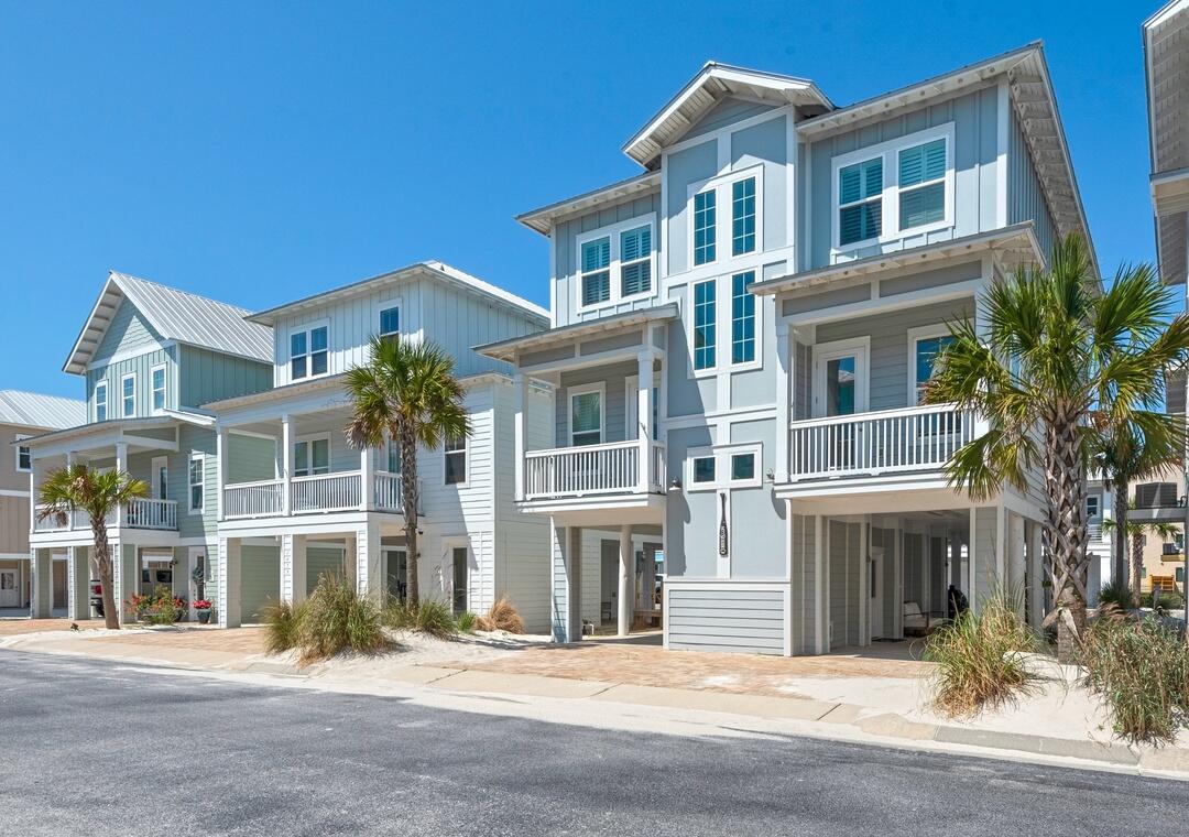 Welcome to paradise! This fully furnished 5-bedroom, 5-bath home in the gated By The Sea community is the perfect private retreat or lucrative short-term rental investment, generating $60-75k annually. Accommodating up to 14 guests, this turnkey property features stunning Inter-Coastal Waterway views and is just minutes from Florida's top-rated beach. The chef's kitchen boasts a wall oven, cooktop, and microwave, with breathtaking views from the back porch. Enjoy resort-style amenities including a community pool, hot tub, and deeded Sound access. Ample parking for up to 8 cars makes hosting large groups effortless. Call today to schedule your private showing!