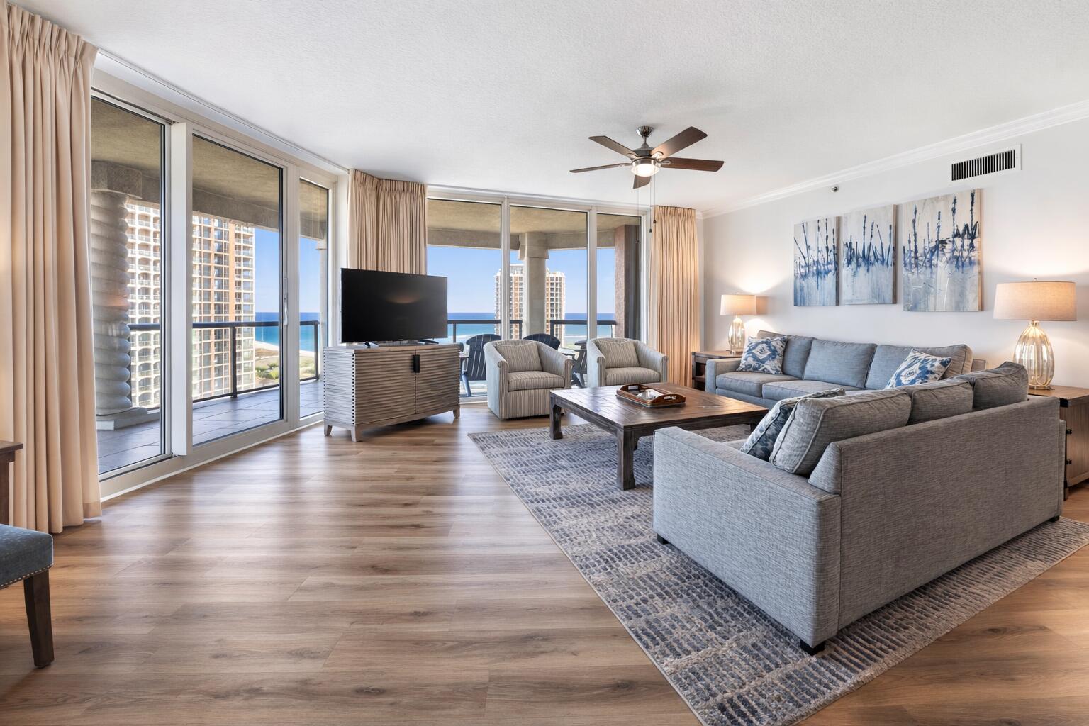 Welcome to luxury coastal living at Portofino Island Resort! This stunning, upgraded twelfth floor residence in Tower 5 showcases breathtaking 180-degree views of the Gulf and Santa Rosa Sound. The residence is being sold FULLY FURNISHED, offering a seamless move-in or rental ready opportunity. With rental history coming in at over $100k, this property offers excellent short term rental potential! This unit offers an expansive balcony (44x17ft) designed for entertaining or taking in the sparkling water views and sunsets. Inside, the open-concept areas are anchored by Gulf views and enhanced by high ceilings and crown molding. Luxury vinyl plank flooring runs throughout the entire unit, complemented by fresh, neutral paint. The kitchen is beautifully appointed with quartz countertops, white cabinetry, sleek backsplash, a breakfast bar, and an adjacent dining area. Each bedroom is privately positioned on its own corner of the unit and each features its own en suite bathroom. The primary suite offers direct balcony access, a spacious walk-in closet, and a beautifully upgraded tiled walk-in shower, double vanities, and a water closet. A second bedroom also enjoys balcony access, a walk-in closet, and an en suite bath with a tiled standing shower. The third bedroom is generously sized to accommodate two beds, includes two closets, and features a bathroom with a tub/shower combo. A half bath sits just off the main living area for guest use. Additional highlights include two assigned covered parking spaces, an assigned storage unit, and a built in grilling area on the balcony. Portofino Island Resort offers unparalleled amenities including direct access to both the Gulf and the Santa Rosa Sound, multiple pools and spas, a full-service spa, a state-of-the-art fitness center, tennis courts, and on-site dining. Only minutes from the dog park and all that Pensacola Beach has to offer, this condo will make you feel at home and on vacation all year long!