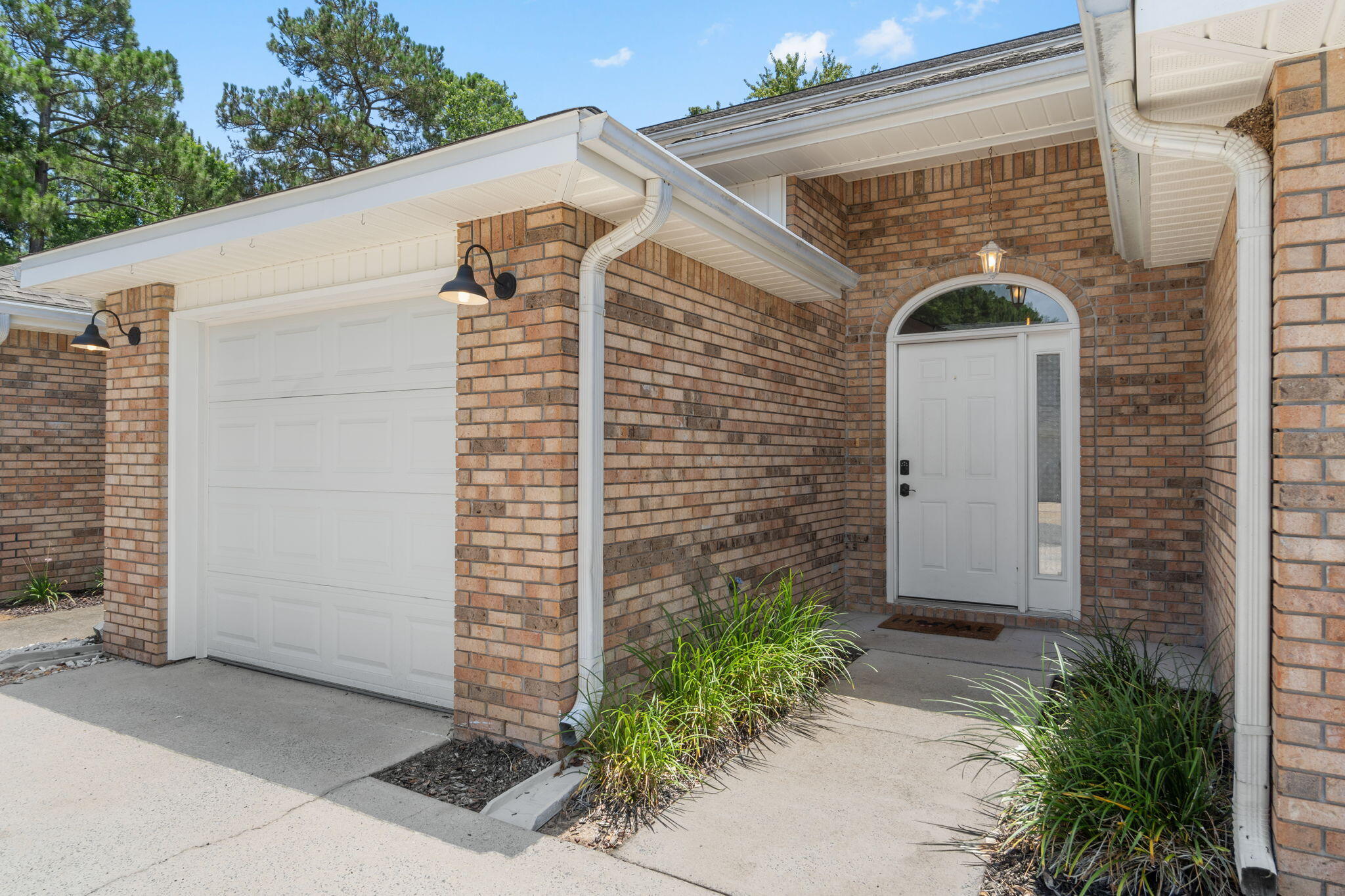 Move-in ready and ideally located, this beautifully maintained 2-bedroom, 2.5-bath townhome offers peace of mind with major updates already completed, including a 2018 roof, 2022 HVAC system, and 2024 water heater. Tucked away in a quiet Mary Esther neighborhood, this home is just minutes from beautiful Emerald Coast beaches, shopping, schools, and only 6 miles from Hurlburt Field, making it an excellent choice for a primary residence, second home, or investment property. Inside, the open-concept living, dining, and kitchen areas create a bright, functional space perfect for everyday living and entertaining. Luxury vinyl plank flooring flows throughout the home, complemented by stainless steel kitchen appliances, updated bathroom vanities, fresh interior paint, updated lighting, and a new kitchen light fixture. Glass sliding doors lead to the private, fenced backyard featuring a new back deck (2025) and newer privacy fencing--ideal for relaxing, grilling, or entertaining guests. Upstairs, both spacious bedrooms feature their own private bathrooms and generous closet space, providing comfort and privacy. A convenient half bath and laundry area are located on the main floor, while the attached one-car garage offers additional parking and storage. With thoughtful updates, low-maintenance living, and a fantastic location, this home offers exceptional value and convenience.
