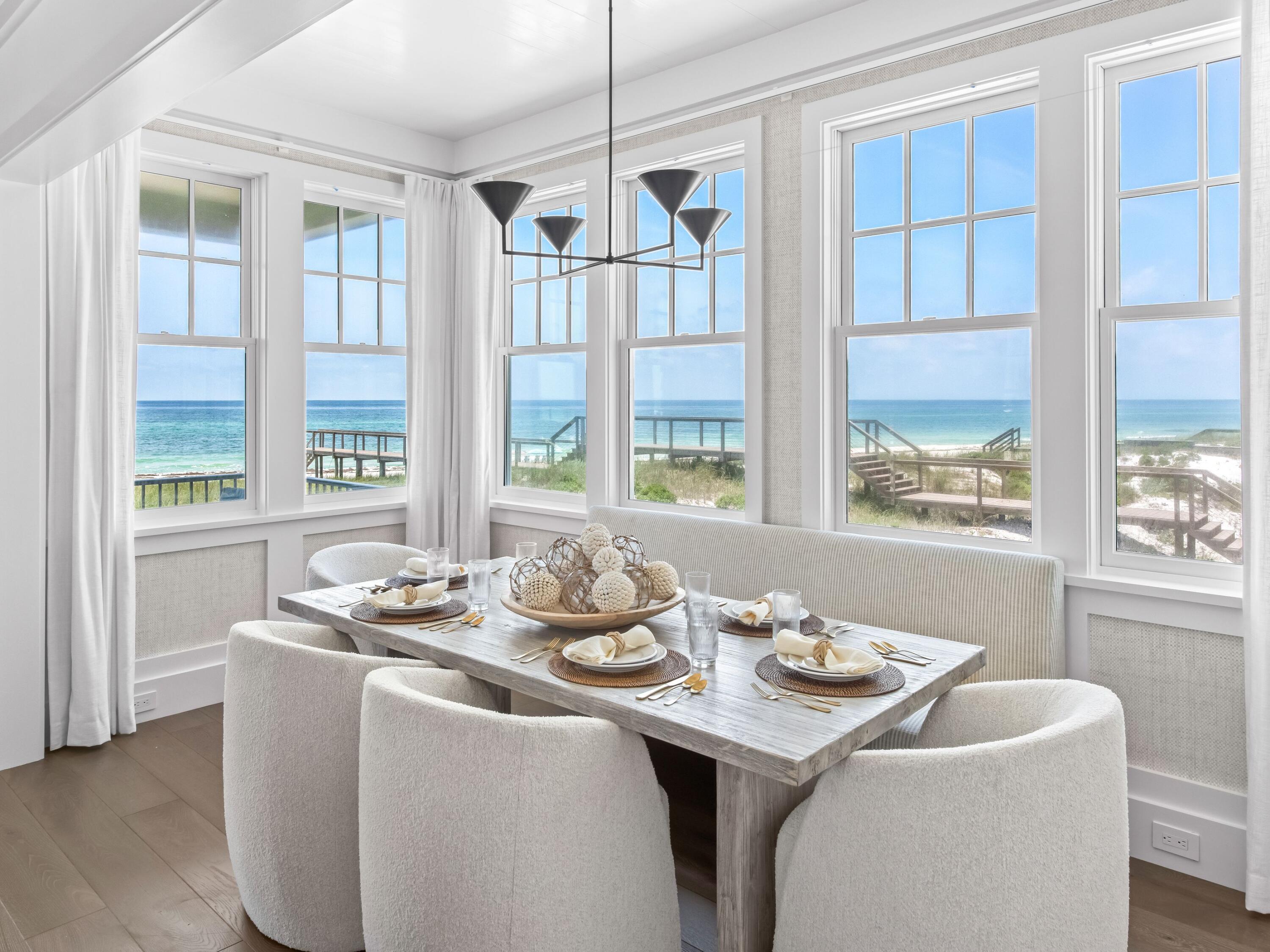 Now complete and move-in ready, 40 Lupin Beach Drive is an architecturally refined Gulf-front home set within one of Inlet Beach's most exclusive beachfront communities. Encompassing 3,038 square feet across four thoughtfully designed levels, this four-bedroom, four-and-a-half-bath residence blends timeless design, curated finishes, and unobstructed views of the Gulf of Mexico.

The home's exterior palette—soft whites, champagnes, and muted grays—sets a serene coastal tone, while the interiors feature wide-plank wood flooring, natural quartzite countertops, and classic shaker cabinetry.