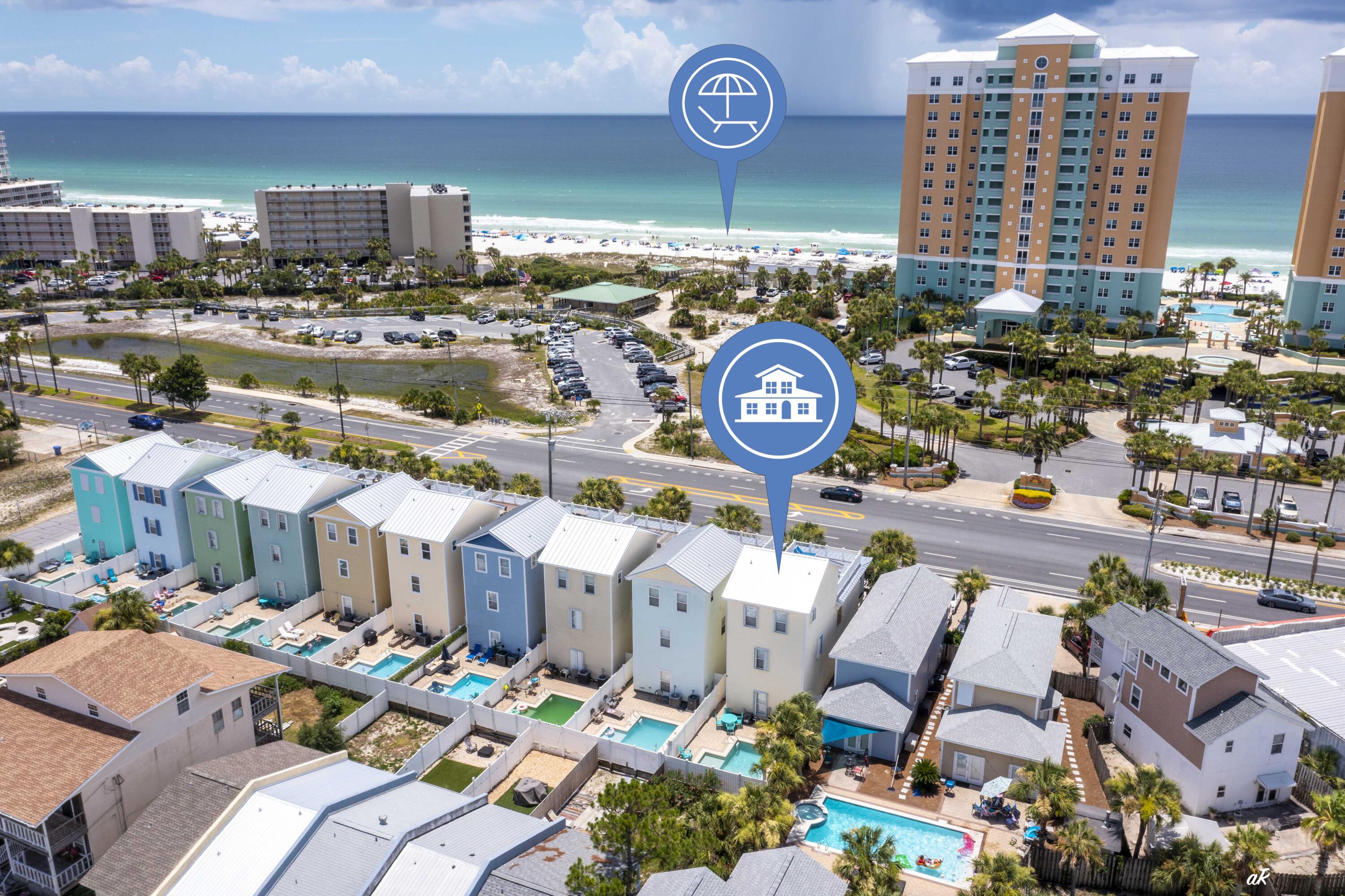 Located directly across Thomas Drive from Rick Seltzer Park, this 3-story, 4BR/3.5BA home offers prime access to one of PCB's most desirable beach entrances, with lifeguards, showers, parking, and Gulf views thanks to protected frontage. Sold fully furnished, it features $50K+ in upgrades, including new composite decking and roof section. The flexible layout includes multiple suites, loft, and a 3rd-floor entertainment space with vaulted ceilings, wet bar, sleeper sofa, and custom queen bunks. Main living offers 10' ceilings, tile floors, crown molding, fireplace, and natural light. Kitchen has granite, stainless appliances, wood cabinetry, breakfast bar, and pantry. Private fenced yard with heated saltwater pool and rooftop Gulf-view deck.