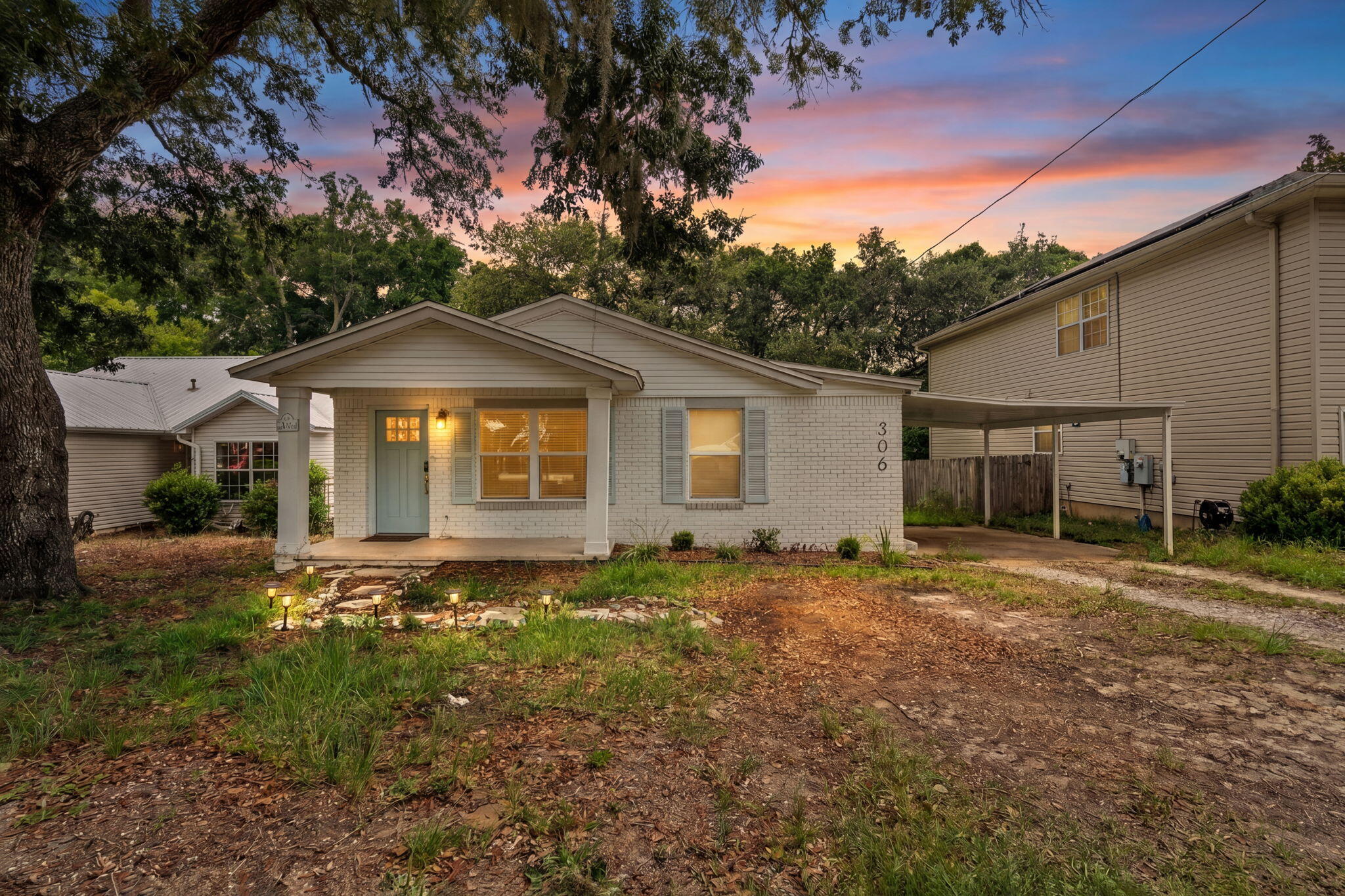Step into the charm of Old Niceville with this beautifully reimagined coastal cottage at 306 Florida Street. Offering 3 bedrooms and 2 full bathrooms, this thoughtfully updated home seamlessly blends timeless character with modern luxury. Originally built in the 1950s, the property has undergone extensive renovations, resulting in an effective build year of 2010 and providing the peace of mind of contemporary systems and finishes.

Inside, you'll find an inviting open-concept living space highlighted by luxury vinyl plank flooring, designer lighting, fresh interior paint, and carefully curated coastal-inspired details throughout. The stunning kitchen serves as the heart of the home, featuring quartz countertops, a striking tile backsplash, stainless steel appliances, a gas range, ample cabinetry, and a convenient pantry.

Each bedroom offers its own unique personality, complete with stylish fixtures and integrated fan-light combinations for year-round comfort. Outside, the private backyard is framed by mature woods, creating a tranquil retreat perfect for relaxing, entertaining, or simply enjoying the natural surroundings.

Conveniently located near schools, parks, shopping, dining, and the bay, this move-in-ready cottage captures the best of Niceville living while offering modern updates wrapped in classic coastal charm.
