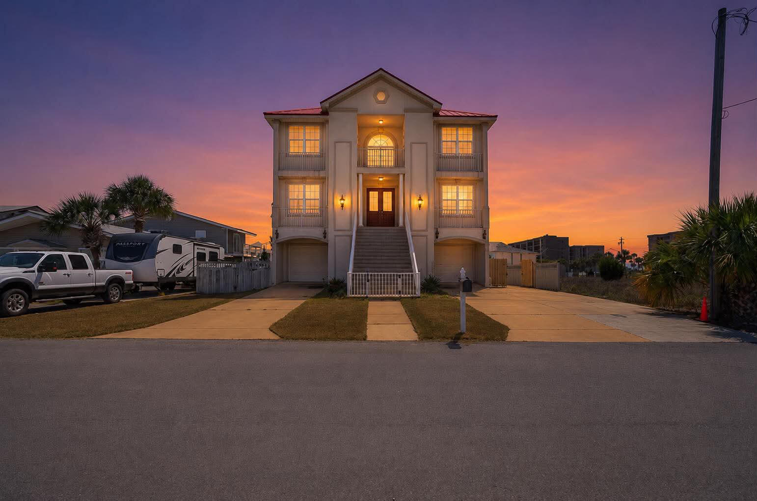 Now Offered at $1,399,000 | Gulf Views & Beach Access 

This spacious Gulf-view home, located directly across from beach access, is designed with families who love the beach in mind. From the moment you step inside, you're greeted by an elegant 20-foot foyer that sets a relaxed, coastal tone for unforgettable family time at the shore.

An impressive hardwood staircase, beautiful chandeliers, and warm, comfortable furnishings create an inviting atmosphere throughout the home. The large gourmet kitchen serves as the heart of the house, featuring a generous island with breakfast bar seating, granite countertops, white cabinetry, and stainless-steel appliances--perfect for cooking big family meals after a day at the beach.

The first floor offers incredible flexibility for family living and entertaining, with an additional family room, a full second kitchen with a gas range, a dining area, and two guest bedrooms. These spaces can easily double as a kids' hangout, game room, or movie night retreat.

Upstairs, the third floor includes another spacious family room and four additional bedrooms, giving everyone room to spread out and relax. Multiple covered decks on each level invite you to unwind together while enjoying Gulf breezes and sweeping sunset views over both the Gulf of Mexico and Santa Rosa Sound.

With its generous layout, multiple gathering spaces, and unbeatable beachside location, this home is perfect for families who want to make lasting beach memories.