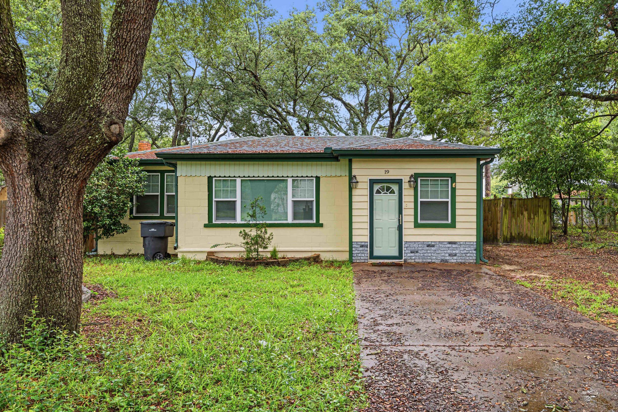Opportunities like this don't come around often! Whether you're looking for a primary residence with income potential, a flexible investment property, or a place with room for all your toys, 19 SW Comet Street offers a truly unique setup. This 2-bedroom, 2-bath home is configured to function as either one residence or two separate 1-bedroom, 1-bath living spaces, creating options for multi-generational living, long-term rentals, or guests.
Outside, the possibilities continue. The fenced backyard features a tiki bar, firepit, detached garage with power and water, and convenient access from both the front and rear streets--making it easy to store a boat, trailer, or other equipment. There's even a 50-amp RV hookup complete with water and electric connections.
Major improvements include a roof installed in 2016, updated electrical completed in 2019, and added flexibility throughout the property. While the home could benefit from cosmetic updates, its unique layout, functional outdoor space, and versatile use options make it a standout opportunity in Fort Walton Beach.