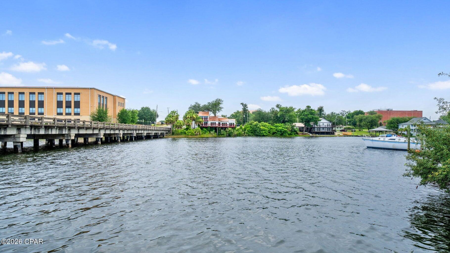 $7100 per month or $85,200 per year in rental income from the carriage house and quadplex/fourplex. Perfect for a DSCR loan where your rental income pays for your mortgage, plus you get a dock and a place to park your boat on deep water. Waterfront masterpiece with deep water access to the Bay and the Gulf of Mexico. This is the most versatile quadplex/fourplex plus carriage house (comes fully furnished) in Panama City. Here is the rental income breakdown: Carriage house = $1750 per month; Apartment 1 (Civil Contractor) = $1450 per month; Apartment 2 (Realtor) = $1450 per month; Apartment 3 (Property Maintenance Man) = $1,000 per month (reduced because he takes care of the lawn and pool - you could charge $1450); Apartment 4 (Josh) = $1450 per month Total income = $7100 per month.
 New custom landscaping and beautiful decking, shared dock with fish cleaning station. Location is easy to access to newly renovated downtown entertainment with shopping, dining, concerts and ongoing festivities. Direct views of Massalina Bayou offering serene surroundings and a true coastal lifestyle. Prime location near top shopping, dining, entertainment, and local attractions. This unique combination of parcels provides endless possibilities--multigenerational living, a fully income-producing investment, or use the carriage house a primary residence and rent out the fourplex for excellent rental income. With its unmatched flexibility, new construction quality, and breathtaking bayou views, this property checks all the boxes.