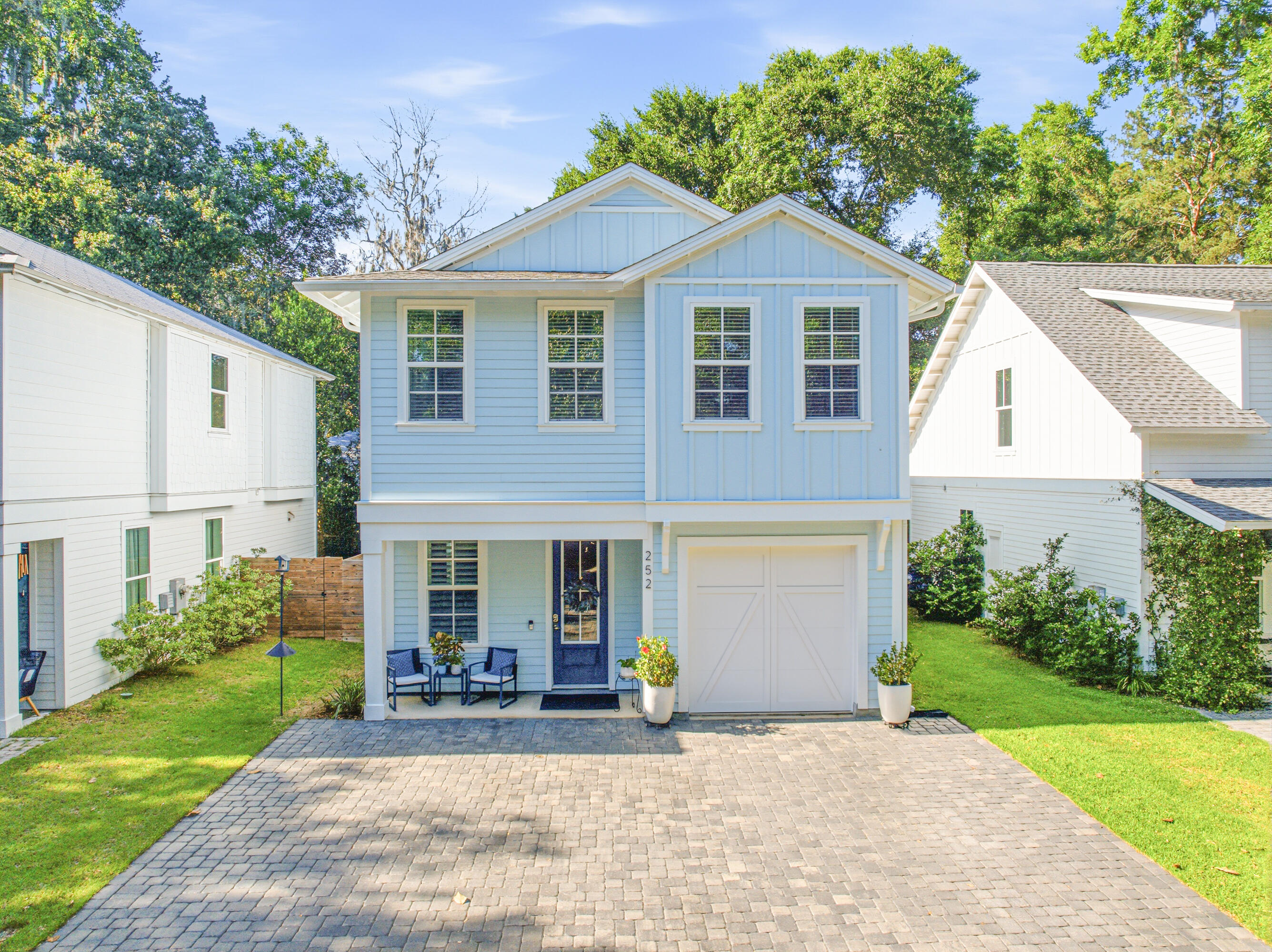 Nestled in the magical bayou-front Sacred Oaks community with neighborhood dock access and direct connection to the bay, this beautifully upgraded home by luxury builder CoaStyle Homes perfectly captures the essence of coastal living. Located just minutes from the area's sugar-white beaches, you can hop on your golf cart and head to Grand Boulevard for dinner, movies, ice cream, coffee, or shopping. Surrounded by majestic oak trees and known for its charming brick-paved streets, picturesque wooden bridge walkover, friendly neighbors, and peaceful waterfront setting, this one-of-a-kind community offers a relaxing lifestyle. Conveniently located near Ascension Sacred Heart Hospital, this home combines beauty with everyday convenience.

Thoughtfully designed with high-end finishes throughout, this home features luxury vinyl plank flooring, crown molding, plantation shutters, custom closets, impact windows, and a striking electric fireplace with a built-in bench that creates a warm and inviting focal point in the living area.

 The open floor plan is ideal for entertaining and every day living. The first floor includes a flexible bedroom that can also serve as a private office, along with a full bathroom with an enclosed glass shower.  The spacious living area flows seamlessly into the chef's kitchen, complete with a large island with quartz countertops, custom cabinetry, stainless steel appliances, a gas stove, and elegant gold hardware. The pantry and under stairs storage provide added functionality.

Upstairs, the spacious primary suite offers a spa-like walk-in shower and an incredible custom-designed closet. Two additional guest bedrooms upstairs provide comfortable accommodations for family and visitors, while the upstairs laundry room with built-in cabinetry adds every day convenience.

A rare golf cart garage offers endless versatility and can easily serve as a workout room, hobby space, or additional storage. The attic also includes added storage access.

Outside, enjoy a newly redesigned deck with gates, upgraded horizontal fencing, gutters, and a fenced trash enclosure that enhances the home's polished exterior. 

Whether you are paddleboarding along the bayou, fishing from the community dock, or gathering with neighbors to watch the sunset, this home offers a peaceful coastal setting and is ready for you to make lasting memories. Schedule a showing today!