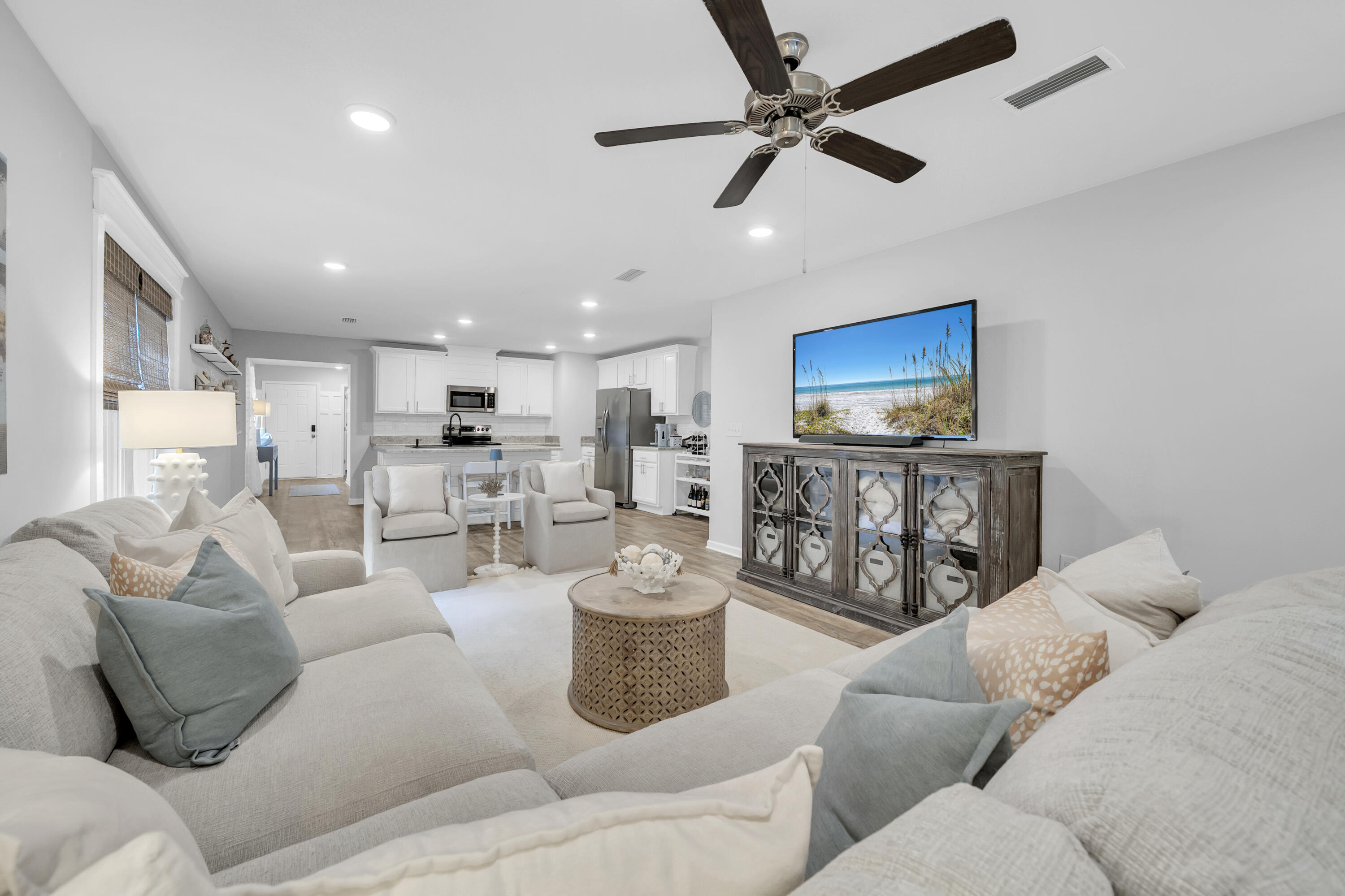 Welcome to 605 Earl Godwin Road in the sought-after Crescent Mill neighborhood of Hammock Bay! Built in 2019, this beautifully maintained 3-bedroom, 2-bath home offers 1,646 square feet of thoughtfully designed living space and one of the most attractive entry points into one of Northwest Florida's premier master-planned communities.

Inside, you'll find an open-concept floor plan that seamlessly connects the living, dining, and kitchen areas, creating the perfect space for everyday living and entertaining. The kitchen has been enhanced with updated cabinetry, offering both style and functionality. The spacious primary suite and two additional bedrooms provide comfortable accommodations for family, guests, or a home office.

Step outside to enjoy your own private backyard retreat. The fully fenced yard backs to a peaceful wooded preserve, providing added privacy and a natural backdrop. Relax year-round on the screened porch or gather with friends and family on the extended paver patio, perfect for outdoor dining and entertaining.

Living in Crescent Mill means enjoying a low-maintenance lifestyle, with HOA dues covering lawn maintenance and basic cable service. Residents also have access to Hammock Bay's incredible amenities, including resort-style pools, fitness center, sports courts, walking and biking trails, parks, playgrounds, and the community clubhouse. Enjoy a vibrant social calendar with monthly farmers markets, live music, seasonal celebrations, and community events that make Hammock Bay one of the area's most desirable places to call home.

Whether you're a first-time buyer, downsizing, or looking for a move-in-ready home with exceptional amenities, this property offers an outstanding opportunity to enjoy the Hammock Bay lifestyle at an exceptional value.

Disclaimer: All information is deemed reliable but should be verified by the buyer as desired.