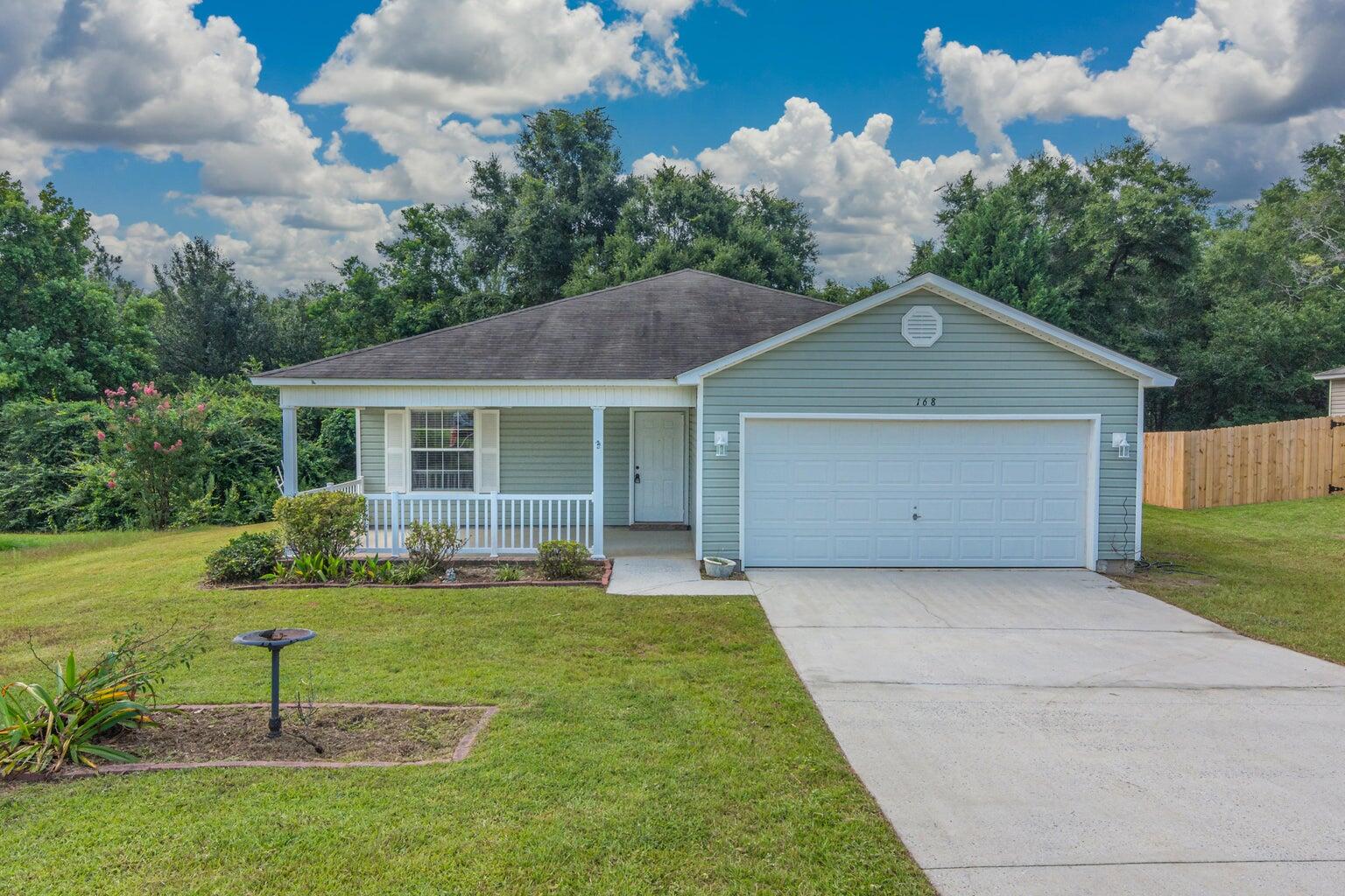 Welcome to this charming home nestled in the desirable Ridgecrest Estates community. Boasting a beautiful front porch, this home is filled with southern charm.  Inside, you'll find a thoughtfully designed split floor plan featuring 3 bedrooms and 2 bathrooms, complemented by cathedral ceilings that create an open, airy feel. The home offers durable laminate flooring throughout, no carpet, making it both stylish and easy to maintain.
Roof replaced in 2021