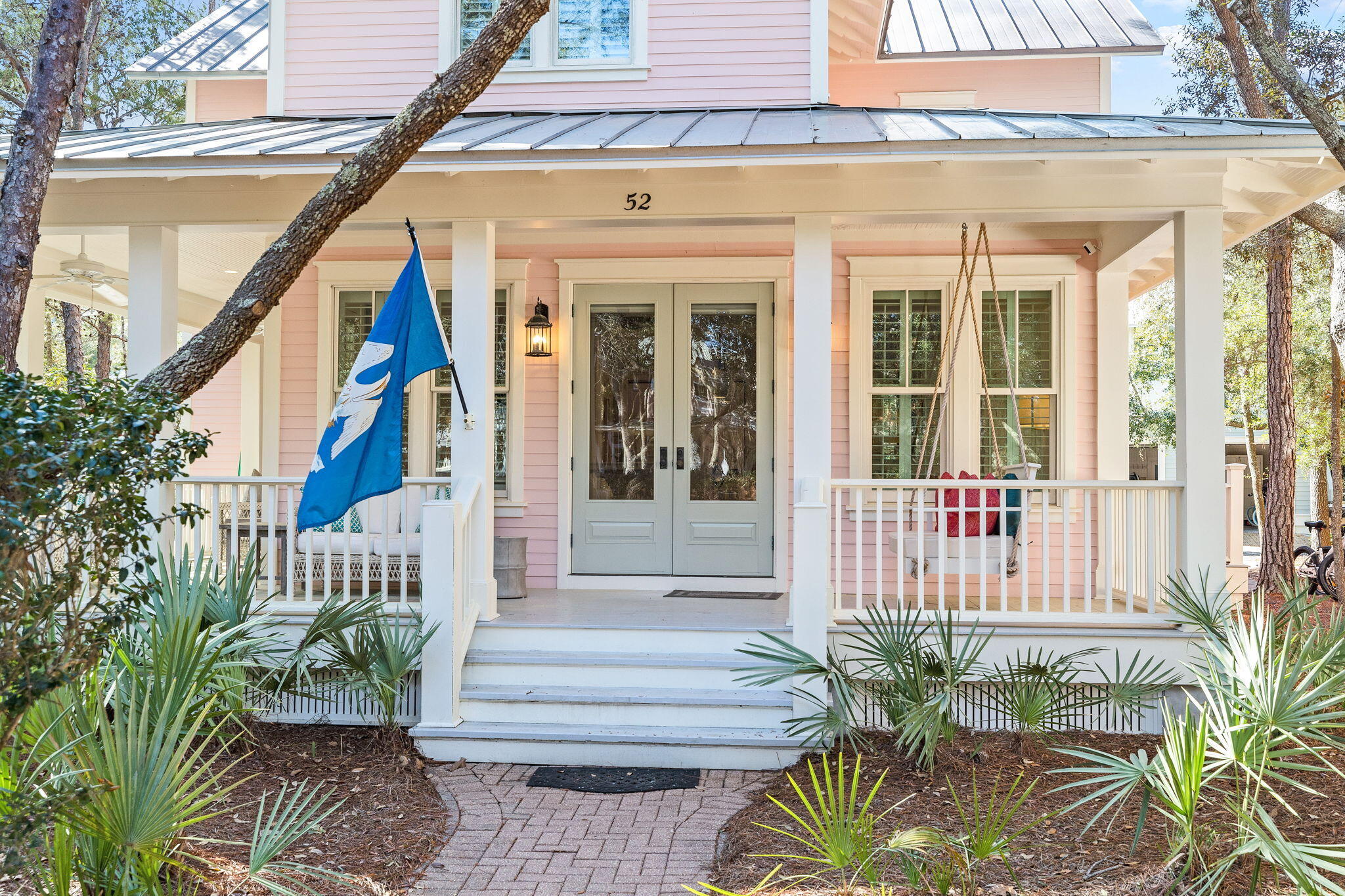 Located in Phase 1 Watercolor, 4 Bedroom, 4 1/2 bath property with a gorgeous wrap around porch overlooking Crimson Park in Watercolor! This home has just been renovated and newly furnished and is gorgeous! The home offers plantation shutters throughout and has lots of natural light making it warm and bright and has all of the beach feels. The dining area is adorned with shiplap walls and crown molding and is an inviting area to enjoy dinner with family and friends. The kitchen offers marble counter tops and a large breakfast bar, beautiful white cabinetry, stainless steel gas range and microwave oven, deep single basin sink and cabinet fronted dishwasher and refrigerator, beachy blue subway tile backsplash and a window cut out into the large living area that has a little office nook,