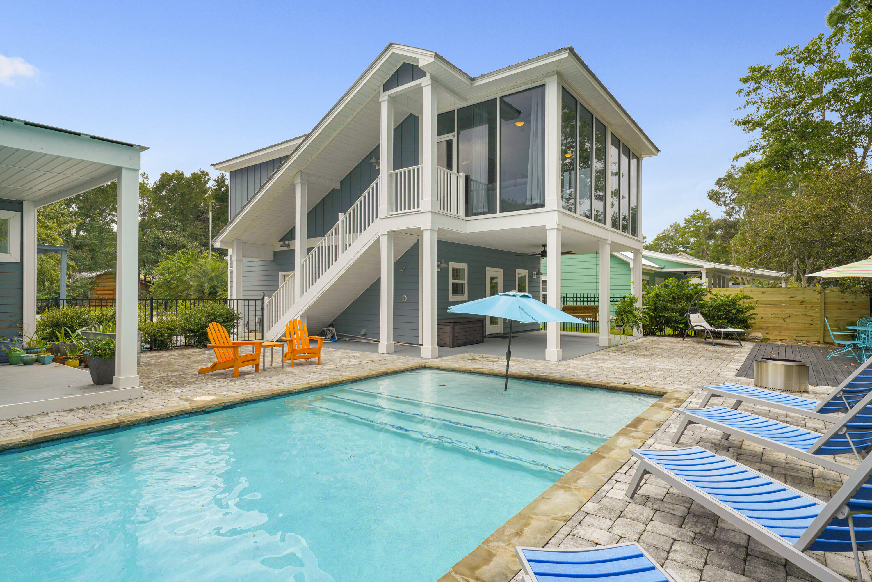 Never miss a day on the water while you build your dream home. Offering 75 feet of waterfront in the heart of Santa Rosa Beach, this rare property combines immediate enjoyment with future potential--and no HOA restrictions. Complete with a private dock, covered boat lift, and direct access to Choctawhatchee Bay, it's designed for effortless days on the water from the moment you arrive. The outdoor living experience is equally inviting, featuring a private pool, expansive multi-level decking, and a fully equipped outdoor kitchen--ideal for entertaining or unwinding after a day on the bay. A charming two-story carriage house offers comfortable accommodations while you plan and build. This 2-bed, 2-bath residence has a full kitchen, dining area, additional living space, and a walk-in closet. Upstairs, a spacious four-seasons room--heated and cooled--boasts floor-to-ceiling windows on three sides, capturing peaceful water views and natural light throughout.

Whether you're envisioning a primary residence, second home, or investment opportunity, this property delivers a rare chance to enjoy waterfront living now while creating something truly exceptional for the future.