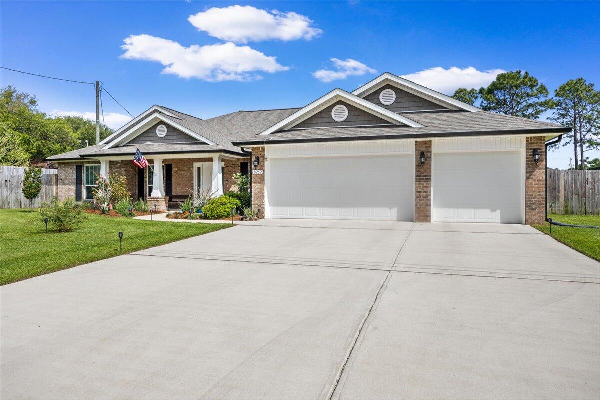 This one doesn't just check the boxes, it's designed to stand out in today's market with the features buyers are actively searching for in Navarre, Florida real estate.

Welcome to this beautifully upgraded 4-bedroom, 3-bath home with a 3-car garage in the heart of the Florida Panhandle--offering a highly desirable split floor plan, modern finishes, and indoor-outdoor living that defines the Navarre lifestyle near the Gulf Coast.

From the moment you step inside, you're greeted by a versatile flex space--ideal for a home office, remote work setup, or formal living room--plus a dedicated dining area perfect for hosting. The interior has been painted in a coastal, beach-inspired color palette, creating a light, airy feel buyers love in Florida homes for sale.

The open-concept layout is exactly what today's buyers are searching for, with the kitchen overlooking the family room-perfect for entertaining and everyday living. This upgraded kitchen features:

Granite countertops
Stainless steel appliances
Glass tile backsplash
Large center island with new designer light/fan fixture
Pots-and-pans drawers for easy organization
Recessed and pendant lighting
Oversized walk-in pantry

The primary suite offers a true retreat with private access to the covered lanai, ideal for morning coffee or evening relaxation. The spa-like ensuite includes a zero-entry walk-in tile shower, soaking tub with custom tile surround, and a spacious layout designed for comfort.

Three additional bedrooms all feature walk-in closets and ceiling fans, while one bathroom functions as a cabana bath with exterior access--a must-have for buyers considering a future pool or outdoor entertaining space.

Step outside to your fully fenced, cleared, and irrigated backyard, complete with fruit trees and room to create your dream outdoor oasis. There's even a chicken coop for those wanting a touch of homesteading-- fresh eggs right in your own backyard!

Additional high-value features include:

*3-car garage (ideal for storage, golf cart, or workshop space)
*Fabric hurricane shields for storm protection,
*Energy-efficient construction package (lower utility costs)
*Blinds installed on all functional windows
*Transferable Maverick STRUCTURAL warranty for buyer peace of mind
* Located in sought-after Navarre, FL, this home offers easy access to Navarre Beach, Hurlburt Field, Eglin AFB, and top-rated schools, making it ideal for military relocation, primary residence buyers, and investors alike.

If you've been searching for a move-in-ready home in Navarre with upgrades, space, and outdoor living, this one delivers. Schedule your private showing today and experience why so many buyers are choosing to call Navarre home.