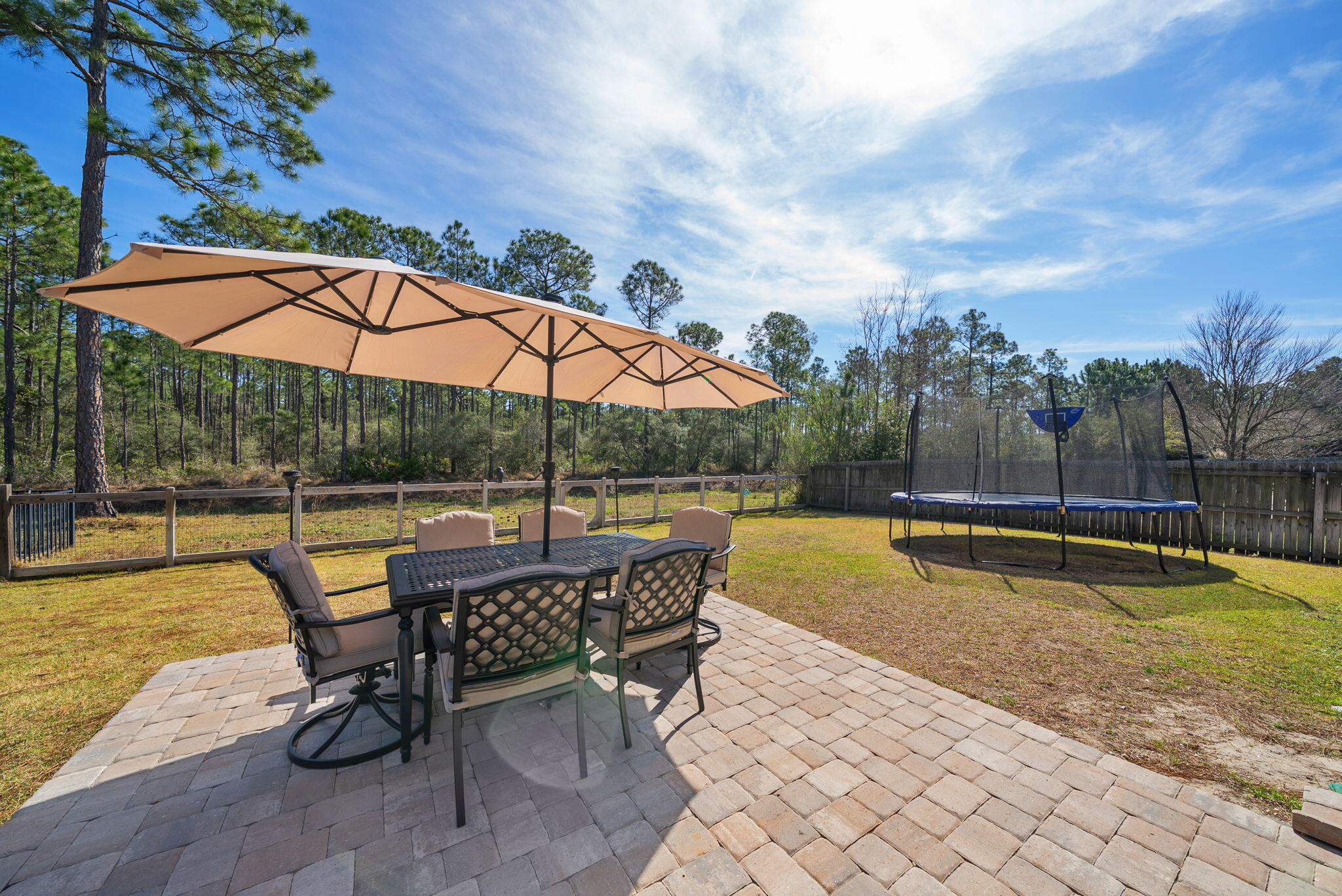 PRIVATE BACKYARD RETREAT backing to Preserve, Under $500K Near 30A!  An immaculate, maintained home with 3 bedrooms, 2 baths with bonus room great for 4th bedroom, office, or workout room. Located in the serene coastal living at Whispering Lake this charming home offers close proximity to beaches, shopping, dining and medical facilities. The large fenced-in yard ensuring privacy with no future development behind. The home has been meticulously cared for with fresh interior paint, luxury vinyl flooring, & new carpet. The expansive living area flows with the spacious kitchen featuring a breakfast bar and dining area. Large master suite with a custom closet, bath with double vanities, walk in shower, and separate tub. The patio has been extended to offer a larger space for outdoor entertaining! The home also includes a double-car garage and showcases a low-maintenance exterior of brick and Hardi-siding. Lots of natural lighting throughout this home. Less than 10 minutes to the World's Most Beautiful Beaches! Enjoy the conveniences of fine and casual dining, shopping, and Sacred Heart Hospital is less than 15 mins away!   Buyer to verify all data and dimensions.