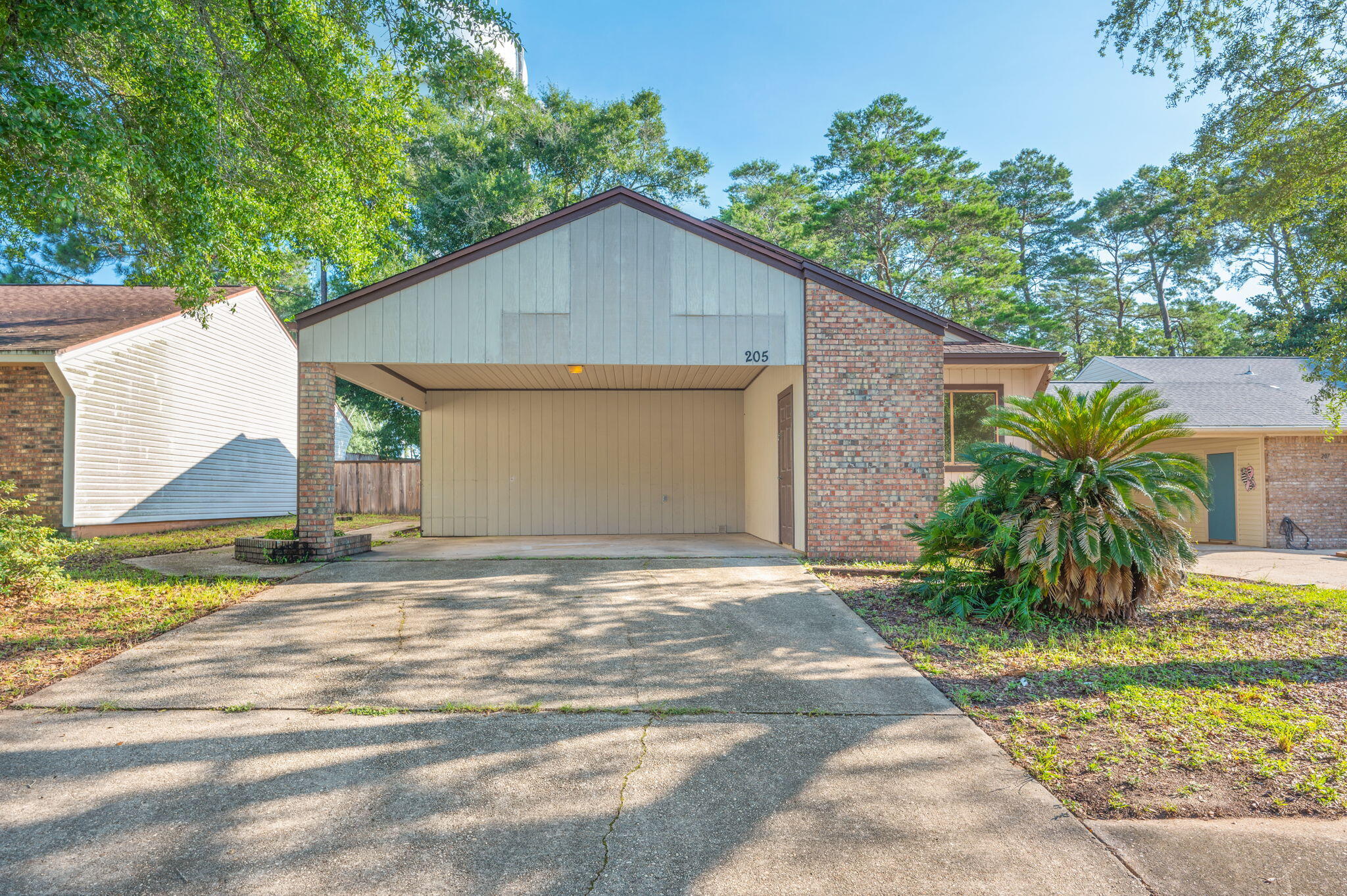 Move-in ready and even better--seller to install new siding & a new roof prior to closing! This 3BR/2BA home offers low-maintenance living with tile & laminate flooring throughout. The open kitchen features SS appliances and overlooks the main living areas, creating a functional layout for everyday living. The spacious primary includes an ensuite bath with a walk-in shower, single vanity with ample cabinet storage, and a walk-in closet. The laundry room is equipped with shelving and a raised platform for the washer and dryer for added convenience. The guest bath offers a cultured marble vanity and tub/shower combo. Step outside to enjoy the fenced backyard, perfect for pets, play, or relaxing. A covered carport with attached storage room provides additional space for tools, seasonal items, or hobbies. Conveniently located with easy access to Eglin AFB, Duke Field, and Northwest Florida State College, as well as shopping, dining, and everyday amenities. A great opportunity to own an updated home in a desirable location with major exterior improvements already planned!
