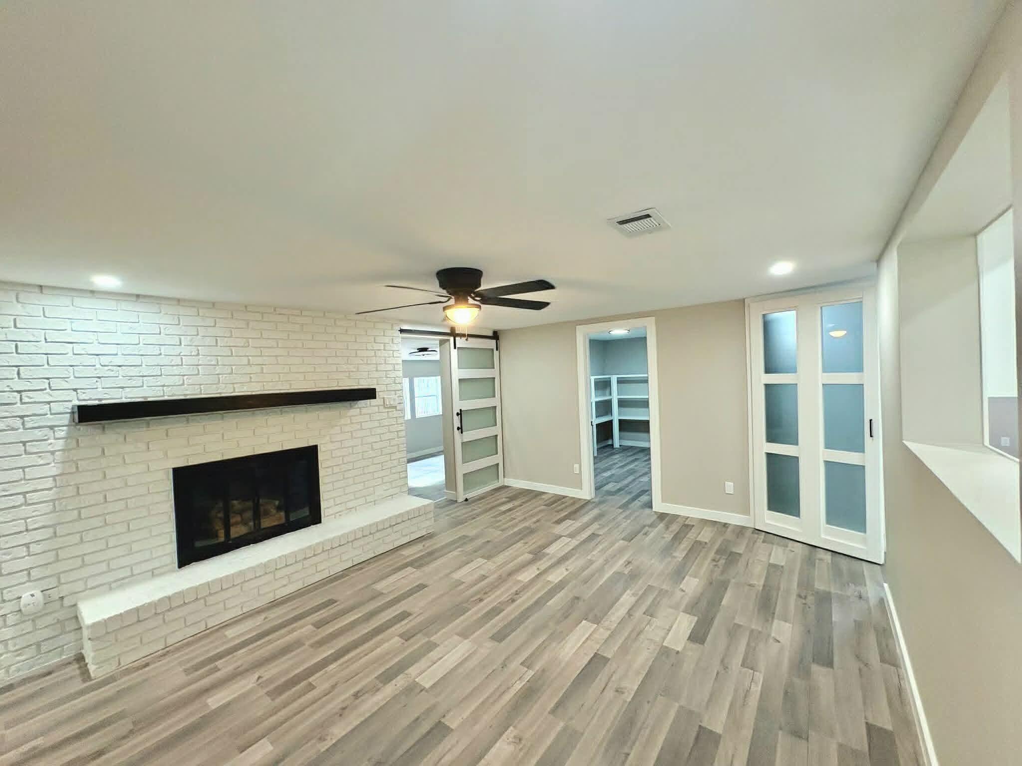 Expanded & Renovated From Top To Bottom

This 4-bedroom, 2-bathroom home was transformed from a 3/1 to now a monsterous  2,400 sqft of living space plus 620 SF of workshop that could remain that or possibly a guest room. Over $125K invested in premium upgrades. Open floor plan features 12mm luxury vinyl plank flooring, gourmet kitchen with 3cm granite countertops, travertine farmhouse sink, and custom soft-close cabinetry. Primary suite boasts barn doors with glass accents, dual closets, and spa-like bath with floor-to-ceiling tile, semi-frameless enclosure, and Schluter trim. Second bath completely upgraded with Red Gard waterproofing and cementitious backer board. NEW roof components, HVAC serviced with duct cleaning and antimicrobial treatment, all-new electrical devices and LED lighting, PEX plumbing throughout. Exterior features all-new deck, pressure-washed and painted siding, wood rot repairs, new shutters, fenced yard, and professional landscaping. Two outbuildings with steel doors, painted interiors. Near Eglin AFB, schools, beaches, shopping. Turnkey ready. MAJOR EXPANSION & RENOVATION - This home has been transformed from a 3-bedroom, 1-bathroom layout into a spacious 4-bedroom, 2-bathroom residence with approximately 2,400 heated square feet plus an additional 620 square feet of rear outbuilding space in desirable Fort Walton Beach! This move-in ready property offers modern coastal living with thoughtful updates throughout, luxury vinyl plank flooring (LVP) in all main living areas and wet areas, and a warm, welcoming atmosphere from the moment you enter.

The chef's kitchen features 3cm granite countertops with demi edge, white shaker-style RTA cabinetry with soft-close doors and drawers, black drop-in travertine sink with upgraded faucet assembly, trendy backsplash, and brand-new stainless steel appliances -- perfect for entertaining. The modified layout improves functionality with repositioned refrigerator, added panels, and overhead cabinet storage. Eye-catching designer wallpaper accents the wall above the cabinets for a polished, custom look.

The spacious living room centers around a gorgeous white brick fireplace with rich dark wood mantle, creating the perfect gathering space for movie nights and relaxation. Fresh paint, updated finishes, and abundant natural light enhance the clean, modern aesthetic.

Both spa-inspired bathrooms feature custom tile work with Schluter edge trim systems, cementitious backer board with waterproof membrane application (Red Gard), upgraded black plumbing fixtures, and modern LED lighting. The primary bathroom boasts a custom walk-in shower with prefabbed sloped shower pan, recessed wall niche, semi-frameless bypass glass shower enclosure with black hardware, and a shaker-style vanity with vessel sink. The secondary bathroom features a reglazed tub (like new), large shampoo niche, and granite countertop vanity. Both bathrooms include comfort-height toilets and exhaust fan/light combinations.

Major system upgrades include:

New electrical: Replaced all devices and wall plates, updated LED lighting fixtures throughout, new 4-inch recessed LED trims, and ceiling fans with integrated lighting in bedrooms
Plumbing upgrades: New water supply lines, refrigerator water supply line with shut-off valve, garbage disposal, and braided water supply lines for all appliances
Roofing repairs: New roof vent boots, fascia boards, flashing systems at rear addition with ice-and-water shield membrane, and peel-n-stick around chimney
HVAC servicing: Post-construction inspection, ductwork and evaporator coil cleaning with HEPA filtration, antimicrobial treatment, new air diffusers/registers, new digital thermostat, and new AC/Heat unit on rear porch with remote
Exterior restoration: Pressure washing, full interior and exterior paint systems (white and black), wood rot repairs, new soffit and fascia materials, new wood shutters, and new exterior trim packages
Interior finish upgrades include new pre-hung interior door units with black hardware package, new closet barn doors with glass accents, new primed square-stock baseboards and casing trim on all doors and windows, and custom closet shelving systems with hanging rods and bifold barn doors throughout -- including a custom 360° wrap walk-in pantry off the living room.

Outdoor living shines with a fully fenced private yard shaded by mature trees, refreshed deck with new pressure-treated deck boards, shored-up joists, ledger boards for water deflection, and new gate latches, locks, and hardware. The 620 square feet of rear outbuildings offer endless flexibility for hobbies, storage, or workshop space, with new steel entry doors, deadbolts, interior painted shelving, and all keyed to match the main residence.

Landscaping enhancements include tree and stump removal, hand grading, mowing, edging, two new 4x4 PT landscape boxes, new pine straw ground cover throughout front and back

Centrally located just minutes from Choctawhatchee Bay, beautiful Gulf beaches, local restaurants, and with Destin only 20 minutes away. This property captures the essence of ideal Florida living.
this home checks every box.