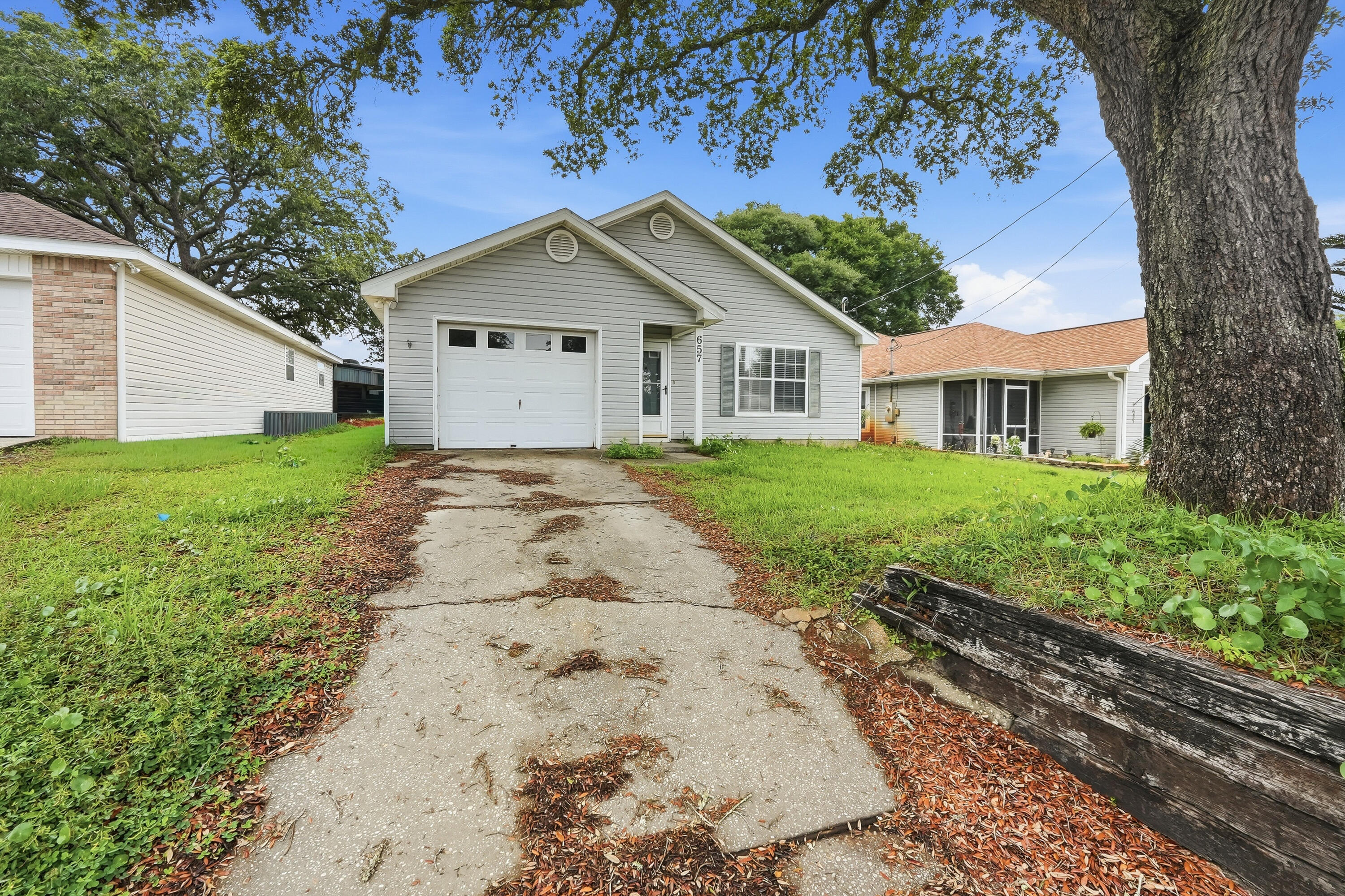 Welcome home to 657 Jerrells Avenue! This charming 3-bedroom, 2-bath home offers comfortable living in a convenient Fort Walton Beach location. Step inside to a bright and inviting floor plan featuring an open living area, abundant natural light, and a functional layout designed for everyday living. The kitchen provides ample cabinet space and overlooks the main living areas, making it perfect for entertaining or staying connected with family and guests. The spacious primary suite includes a private bath, while two additional bedrooms offer flexibility for guests, a home office, or growing families. Enjoy a low-maintenance yard with plenty of room for outdoor gatherings, pets, or play. Conveniently located near Eglin AFB, Hurlburt Field, shopping, dining, schools, and the beautiful Emerald Coast beaches, this home combines comfort, convenience, and value.