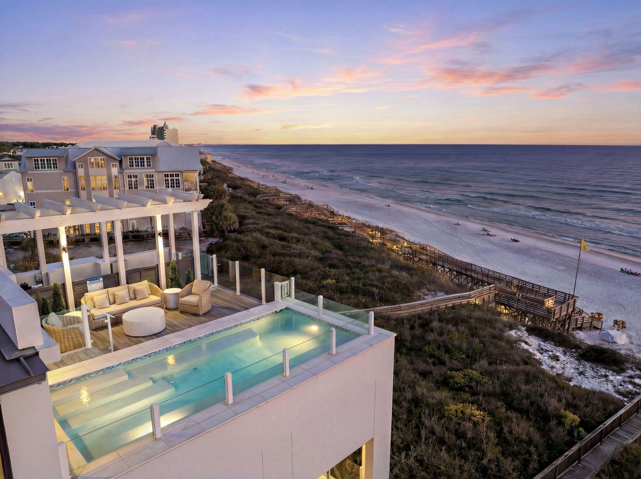Sea Walk Sanctuary is a pinnacle of luxury and sophistication, where every aspect is meticulously crafted to perfection. While the private ground-floor swimming pool offers tranquility, it's the crown jewel--the fourth-floor rooftop pool--that truly steals the spotlight, providing unparalleled panoramic views of the mesmerizing emerald waters below Crafted over years of meticulous design and unparalleled attention to detail, 41 Sea Walk Circle emerges as a triumph of engineering prowess, offering breathtaking unobstructed views from nearly every corner of its expansive 6,608 square feet. Whether you long for the tranquility of a secluded main-level pool or desire to bask in the sun and stars in your private rooftop oasis with a fourth-floor master suite overlooking the infinity pool and

Gulf waters below, this home offers unmatched luxury. Embrace the opportunity to make this extraordinary sanctuary your own, where luxury knows no bounds and every moment is imbued with unparalleled splendor.

Every inch of Sea Walk exudes unparalleled craftsmanship and luxury. Venetian plastering graces the walls, while custom handmade cabinetry adorned by brick and 100-year-old reclaimed wood beams add character and charm. The main level features a master bedroom with an en suite bathroom, a laundry room, a pool bathroom, and a living room with its private bar. Step outside to the main level's private pool and grilling area, or stroll along the custom Ipe decking to the serene private beach nestled amidst dense scrub oak.

On the second floor, a custom crafted cypress elevator leads to a master retreat with a private coffee bar and balcony offering breathtaking views. Another master retreat with balcony access and a whimsically designed bunk bedroom with an oversized bathroom cater to all ages.

Ascending to the third floor, be captivated by 180-degree views from the kitchen and living room's oversized windows and doors. Admire the craftsmanship of the brick fireplace and reclaimed wood beams. A master retreat with Gulf views and a stunning en suite bathroom awaits, along with the fourth-floor entertainment space and suite boasting a private rooftop pool and game room.

Sea Walk epitomizes excellence and attention to detail, offering beauty and tranquility in abundance. Experience the magic of 30A first hand, visit Sea Walk Sanctuary and discover a home that could become a cherished tradition for generations to come.