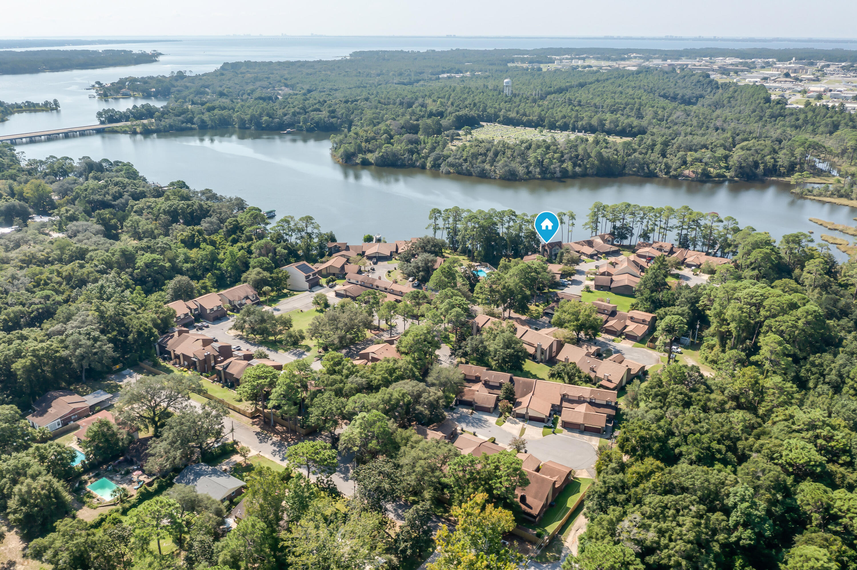 Welcome to your new waterfront community where boating, fishing and water sports are just outside your back door. Live only minutes from Eglin AFB in this sought after community with a waterfront community pool, clubhouse, workout room and a community boat dock (leased slips available). This property sits on Tom's Bayou which is a short boat ride to Destin's Crab Island. This open, and airy home offers gorgeous bayou views from the back porch. Downstairs features include a master suite with a full bathroom, a walk in closet and an additional half bathroom. Open kitchen and beautiful vaulted ceilings with a fireplace and double doors for gorgeous view of the water are key features as well. Upstairs presents a spacious loft for work or play, two bedrooms and a full bathroom. New roof and high impact windows were installed in 2024. All new carpet was just installed in the bedrooms and on the stairs. This home is a one of a kind in this area and with the beautiful water right outside your back door, you will enjoy the beauty of Tom's Bayou every day, ideal as a primary residence or a high-demand rental.

Come see it today!