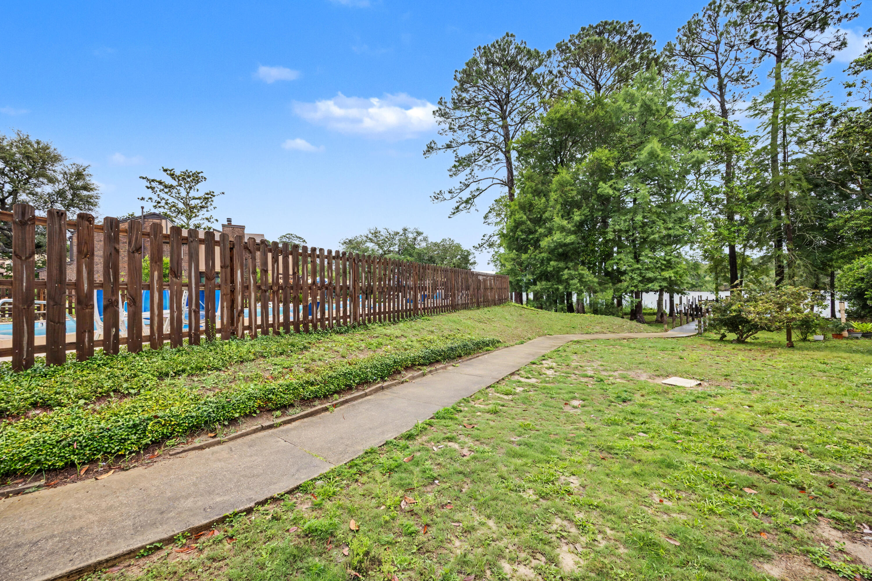 Welcome to your new waterfront community where boating, fishing and water sports are just outside your back door. Live only minutes from Eglin AFB in this sought after community with a waterfront community pool, clubhouse, workout room and a community boat dock (leased slips available). This property sits on Tom's Bayou which is a short boat ride to Destin's Crab Island. This open, and airy home offers gorgeous bayou views from the back porch. Downstairs features include a master suite with a full bathroom, a walk in closet and an additional half bathroom. Open kitchen and beautiful vaulted ceilings with a fireplace and double doors for gorgeous view of the water are key features as well. Upstairs presents a spacious loft for work or play, two bedrooms and a full bathroom. New roof and high impact windows were installed in 2024. All new carpet was just installed in the bedrooms and on the stairs in April. This home is a one of a kind in this area and with the beautiful water right outside your back door, you will enjoy the beauty of Tom's Bayou every day, ideal as a primary residence or a high-demand rental.

Come see it today!