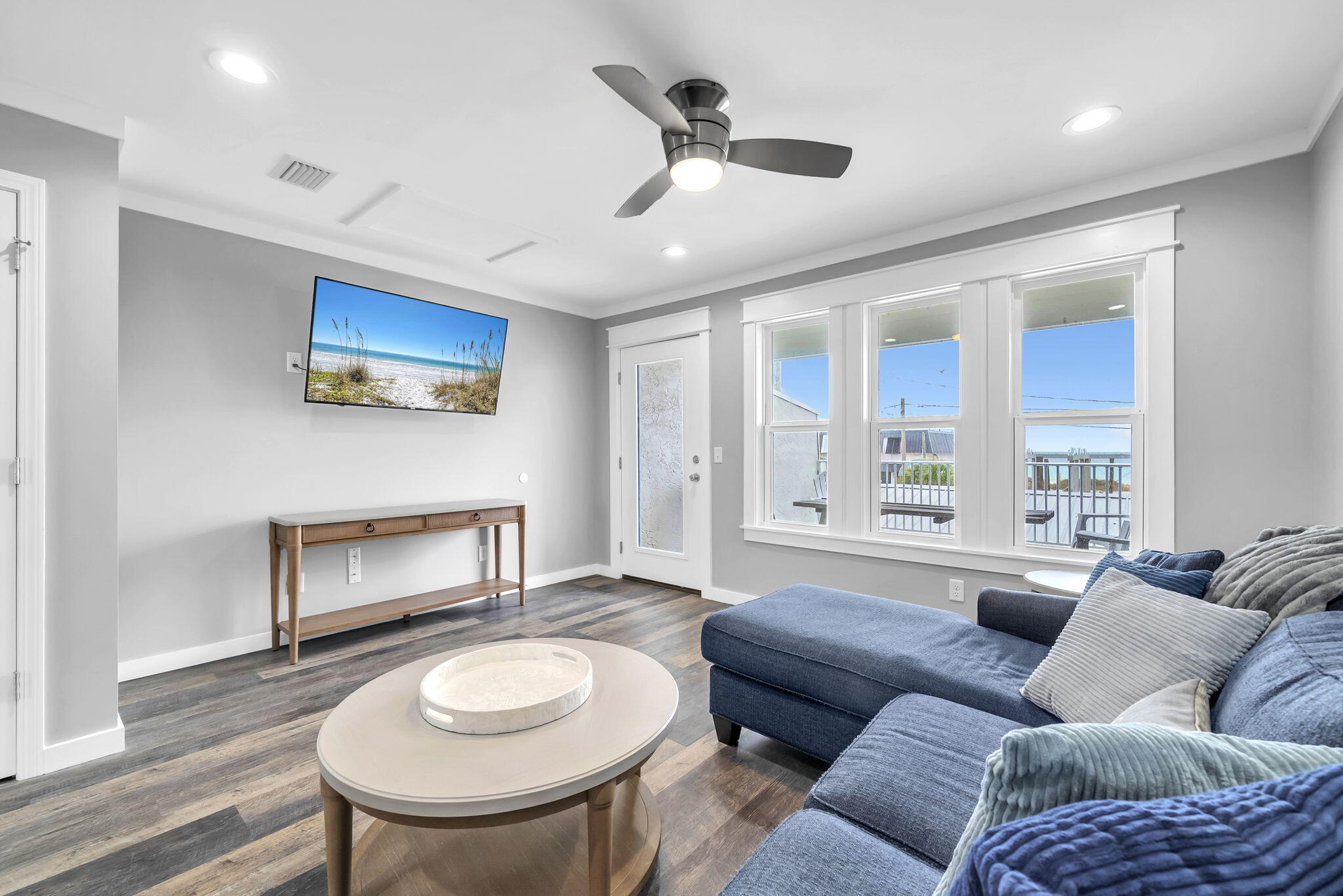 Directly across the street from the Gulf, this 2 bedroom, 2 bathroom townhome offers quick beach access, Gulf views, and updates that help reduce near-term maintenance. Two public beach access points are nearby, and the home is being sold fully furnished, making it a practical option for personal use, a second home, or rental use. For buyers exploring added rental flexibility, the neighboring townhome is also available, creating a rare opportunity to own side-by-side units.

Inside, the layout is set up to comfortably host guests with one king bed and two queen beds. The kitchen, bathrooms, and flooring were renovated in 2019, and the entire unit was freshly painted in 2025, including the walls, trim, and doors.  All furnishings were also replaced in 2025, giving the interior a clean, updated feel. A full-size washer and dryer adds everyday convenience.

The living area opens to a private patio where you can enjoy Gulf views and coastal breezes. A fenced backyard provides private outdoor space to unwind after time at the beach. The home also includes a private garage for beach gear, bikes, and other coastal essentials, plus additional driveway parking for guests.

Nearby destinations include Pier Park, St. Andrews State Park, marinas, waterfront dining, shopping, and local restaurants. Buyer to verify all dimensions.