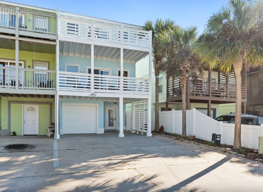 No HOA. Move In Ready!. Renovated 2025.  3 Bedroom & 3 Bath Residence plus Efficiency Studio/ 1 Full Bath. Three story residence has an open living/dining/kitchen. The home features a brand-new roof, new exterior paint, and fresh interior paint.  Fully furnished home with new coastal décor, renovated to meet code, and situated less than two blocks from the white sands of the Gulf of America and its emerald waters! The main residence with spacious 3 large bedrooms, 3 full bathrooms & multiple decks to relax & enjoy the gulf views & beautiful sunsets! One car garage/storage.  In addition to the main residence, a cozy efficiency studio with a fully fenced backyard & private entrance is located on the ground level.   Only 30 minutes to the airport.