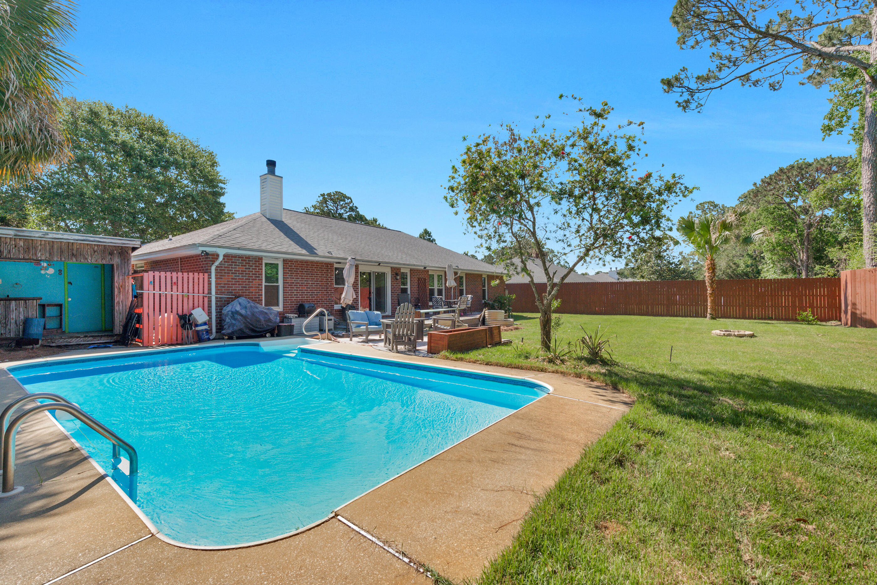 Tucked away at the end of a quiet street in sought-after Gulf Breeze, this beautifully updated pool home offers the perfect blend of privacy, comfort, and Florida lifestyle living. Just minutes from the sparkling waters of the Sound, the Oriole Beach boat ramp, and highly rated Oriole Beach Elementary School, this property delivers the kind of location buyers search endlessly to find. From the moment you arrive, you'll notice the sense of seclusion and space this home provides. Situated on a generous lot with mature surroundings and an inviting backyard retreat, this is the kind of home where mornings begin with coffee by the pool and evenings end under the glow of string lights and Gulf Coast breezes. Inside, the home has been thoughtfully updated and cared for, featuring a remodeled kitchen that serves as the heart of the home, spacious living areas filled with natural light, and a layout that feels both functional and welcoming. The tasteful touches throughout create warmth and personality, while the overall flow of the home makes everyday living easy and enjoyable. The backyard is truly designed for Florida living. The private pool and deck area offer an ideal setting for entertaining friends, weekend cookouts, or simply relaxing in your own personal oasis. Whether you're hosting family gatherings, enjoying quiet evenings outdoors, or spending weekends by the water nearby, this property captures the lifestyle so many buyers dream about when moving to Gulf Breeze. One of the standout features of this home is its location. While offering a tucked-away feel, you're still conveniently close to beaches, shopping, dining, schools, parks, and boating access. Plus, being located outside of a flood zone adds an additional layer of confidence and peace of mind.

With its combination of privacy, updates, outdoor living, and prime Gulf Breeze location, this home offers a rare opportunity to enjoy the best of coastal Florida living in a neighborhood people love to call home.

If you've been searching for a property that feels welcoming, peaceful, and distinctly Florida -- this is the one.