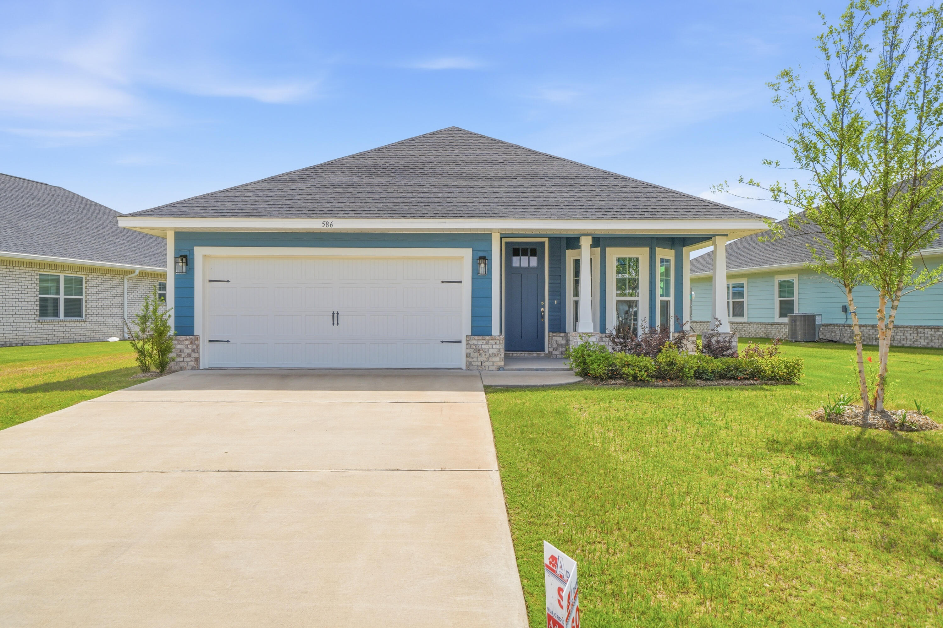 Nestled near the community pool and cabana, this new Craftsman-style home offers convenient access to the world-renowned 30A beaches, just a 20-minute drive away. With three bedrooms and two bathrooms, this home features cathedral ceilings, an 8-foot beautifully crafted front door, a spacious covered patio, quartz countertops in the kitchen and both bathrooms, and luxury LVP flooring throughout. The primary bathroom boasts a separate garden tub and shower, while upgraded Moen faucets, lever-handled hardware, and soft-close drawers add to the home's comfort and style. The property is complete with a sprinkler system. *Some photos may be of similar floor plans and may have been virtually staged to showcase the property's potential.*