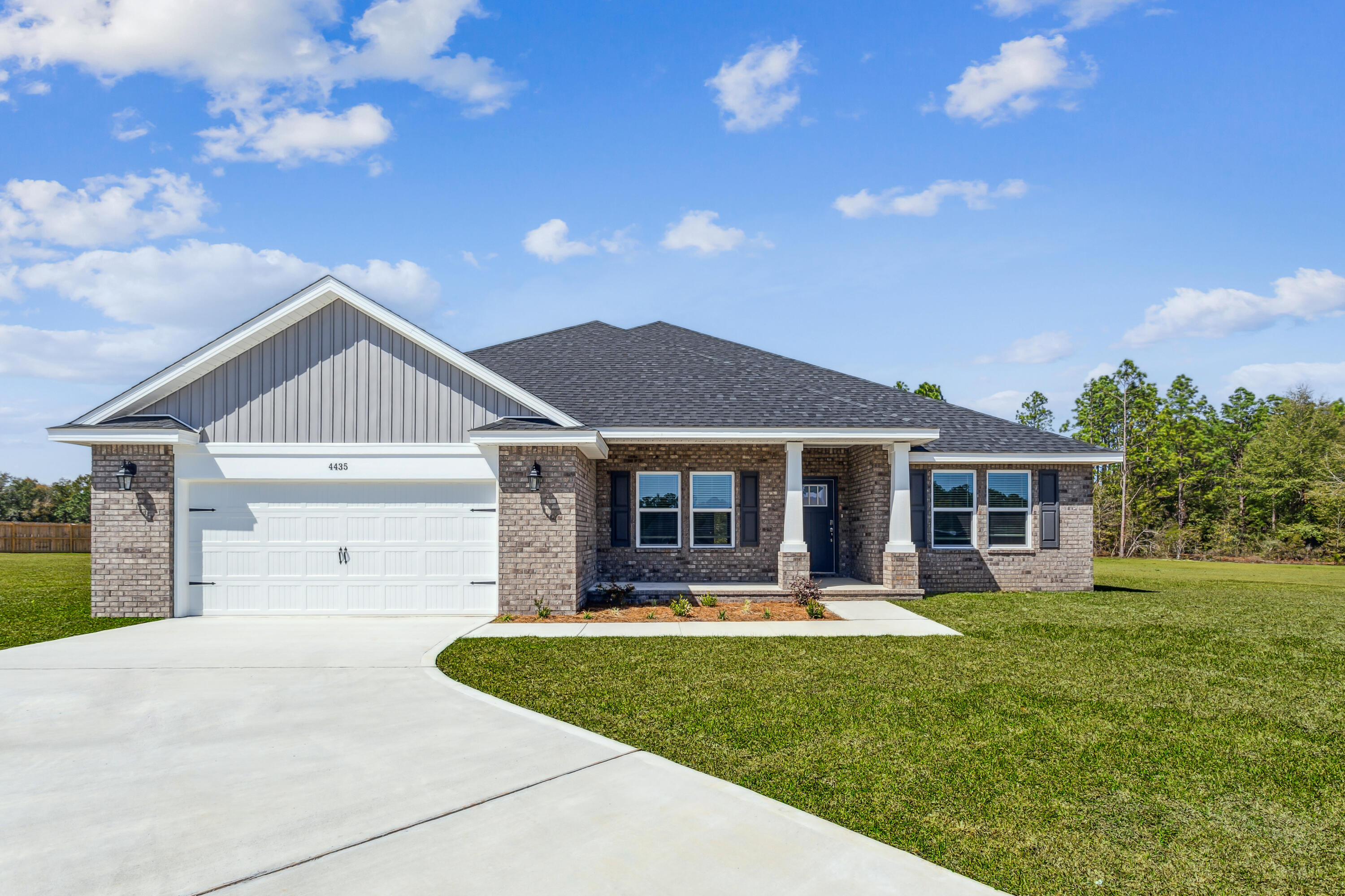 The Turquoise is a beautifully designed 5-bedroom, 3-bath brick home offering a spacious open-concept layout ideal for both everyday living and entertaining. The kitchen includes stainless steel appliances, granite or quartz countertops, soft close cabinetry, under-cabinet lighting, and generous cabinet space, all opening into the great room.
Elegant crown molding enhances the main living areas, and a whole-house 2'' faux wood blind package is included throughout for added privacy and convenience. The luxurious primary suite features tray ceilings and dual walk-in closets. The primary bath has double vanities, a garden tub, and a tiled walk-in shower with dual shower heads. 
A private guest suite with its own full bath provides added comfort for family and visitors. Buckeyes Landing is ideally situated in the heart of Holley-Navarre. The neighborhood is located off Bob Tolbert Road, providing convenient access to major routes including US-98 and State Road 87 for easy commuting east toward Destin or west toward Pensacola. Just minutes from local amenities - including shopping, restaurants, parks, highly rated schools, and world class beaches. 
Projected completion is August 2026.