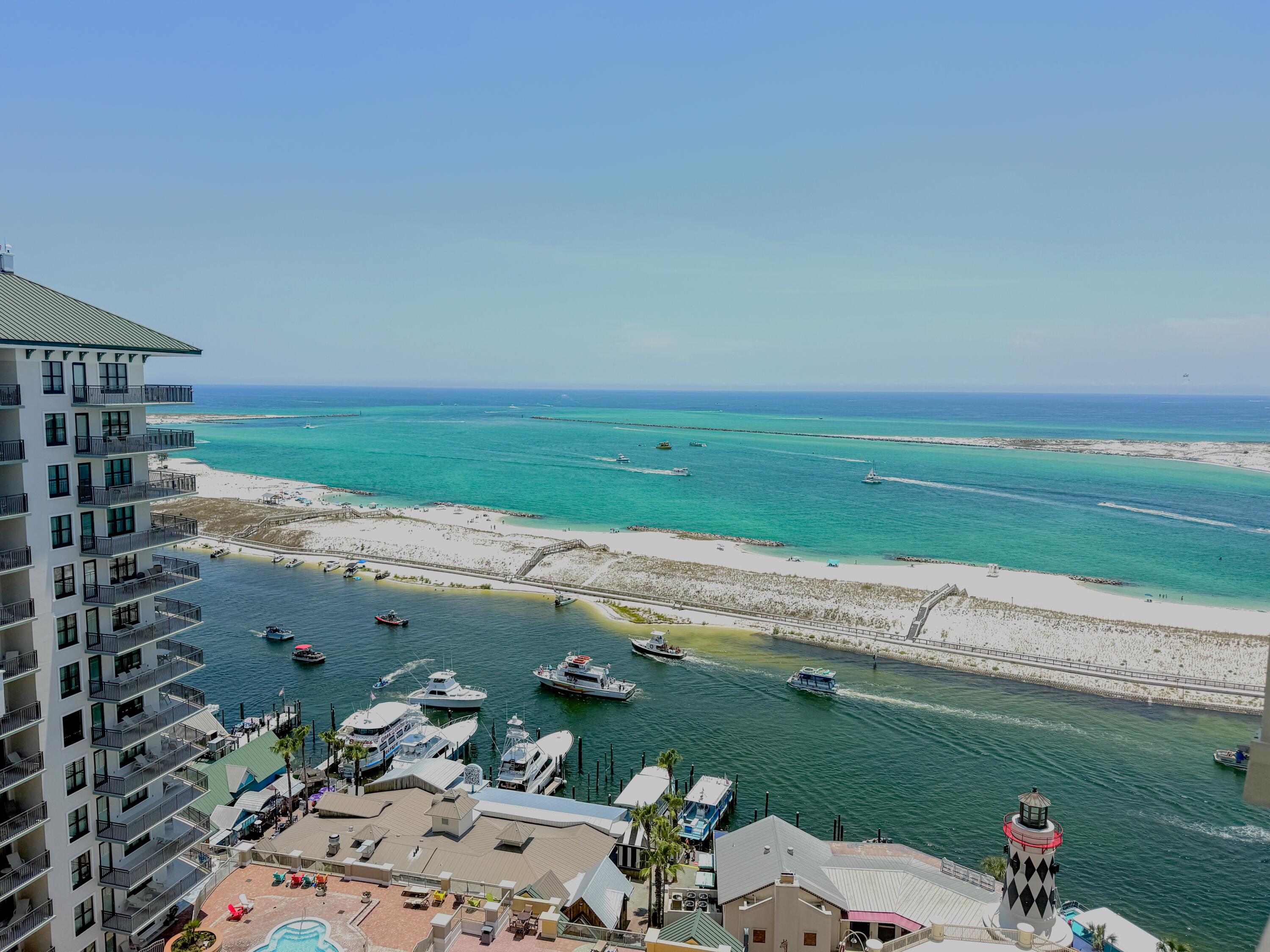 Experience coastal luxury from the penthouse level  2-bedroom plus bunk room, 2-bath condo at Emerald Grande at HarborWalk Village. Perfectly positioned to capture breathtaking views of Destin Harbor, East Pass, and the Gulf of Mexico, this beautifully appointed residence offers two private balconies where you can enjoy sunrises, sunsets, and the constant activity on the water.

Designed with both comfort and investment potential in mind, the open-concept floor plan provides space for family and guests, while the additional bunk room maximizes sleeping accommodations for vacation rentals. Sold fully furnished and rental ready, this condo allows you to begin enjoying or renting the property immediately.

Emerald Grande is one of Destin's premier waterfront resorts, offering an unmatched lifestyle with resort-style amenities including outdoor pool, hot tubs, a fitness center, full-service spa, concierge services, on-site dining, and beach access. Located within HarborWalk Village, you'll have immediate access to waterfront restaurants, shopping, entertainment, fishing charters, watersports, seasonal events, and vibrant nightlife. 

Whether you're searching for a luxurious second home or a vacation rental investment, this exceptional penthouse-level condo offers the perfect combination of location, amenities, and spectacular views. Don't miss this opportunity to own your piece of paradise in the heart of Destin.