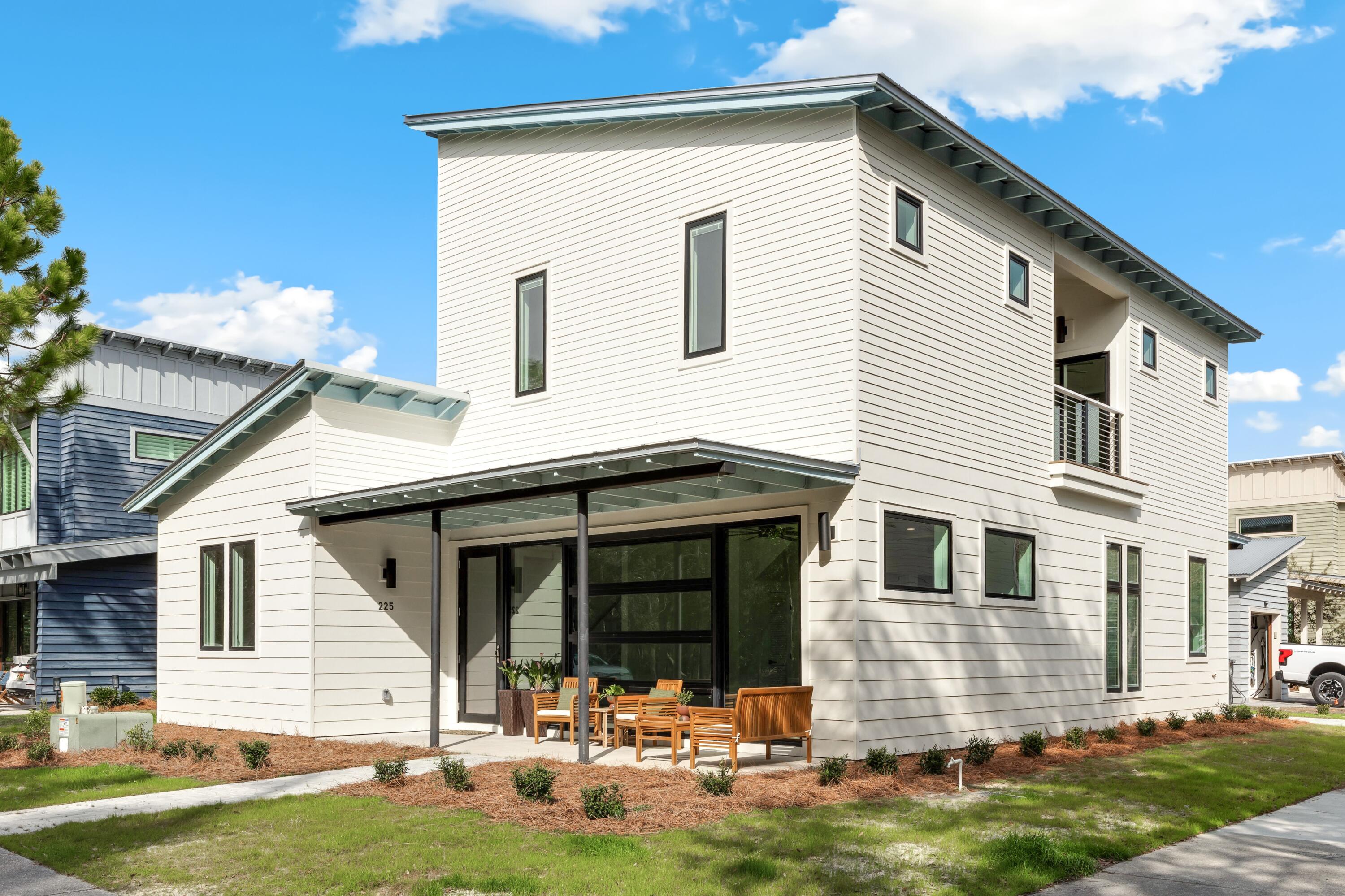 Discover a brand-new contemporary home in the desirable Eden's Landing community, ideally positioned beside Eden Gardens State Park & just moments from Choctawhatchee Bay. 

Overlooking a common area green space, this thoughtfully designed 4-bedroom, 3.5-bath home blends modern style with coastal charm. The main living area features a stunning full glass wall that fills the space with natural light, while 10-foot shiplap ceilings throughout create an open, airy feel. Each bedroom features vaulted ceilings that add character & style.

Primary bedrooms on both the first & second floors offer comfort & flexibility. Upstairs, two ensuite bedrooms share a balcony - an inviting spot to relax and take in the natural surroundings. An additional bedroom on the first floor is perfectly suited for a home office, nursery or playroom, providing flexibility for today's lifestyle.

Situated on a corner lot overlooking a tree-filled greenspace, the property offers a tranquil setting with added privacy. A one-car garage with an attached covered carport provides convenient parking and additional storage.

Eden's Landing is a quiet, family-friendly neighborhood where short-term rentals are not permitted, making it ideal for a primary residence or second home. Residents also enjoy access to a community pool, perfect for relaxing or spending time with neighbors. The Point Washington boat launch is less than a mile away for easy days on the water.

 This builder's own custom home features an Electrolux oven, Bosch 6-burner cooktop, select Pella windows, and a luxurious Waterworks shower, blending quality, style, and performance.

You'll love the peaceful feel of Point Wahington while still being just a five-minute drive from the white-sand beaches, shopping, and dining along Scenic 30A. This brand-new home offers the perfect mix of relaxed living and everyday convenience.