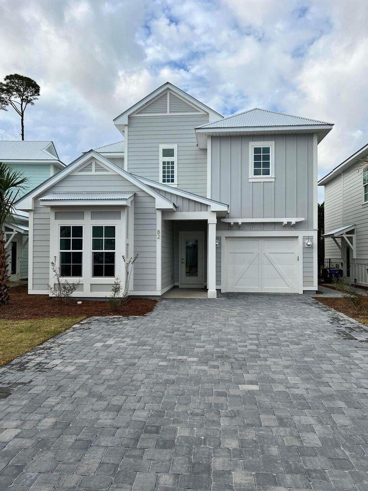 Tucked away in Sugar Sands Estates on the west end of 30A, 82 Sugar Sands Drive presents a rare opportunity for buyers seeking a low-maintenance coastal investment with rental income already in place. Current lease to be honored through 12/12/26, offering immediate stability and income potential from day one.

Backing up to a peaceful nature preserve, this thoughtfully designed home combines functional spaces with elevated finishes in one of Santa Rosa Beach's most convenient locations.

The open-concept main living area was designed with everyday living and entertaining in mind, featuring a spacious center-island kitchen complete with quartz countertops, stainless steel appliances, and seamless flow into the dining and living spaces. Designer details throughout the home include thick crown molding, rounded corners, pocket doors, and beautiful natural light that creates a warm and inviting atmosphere.

The first floor includes a private guest bedroom with an en suite bath, ideal for visitors or multigenerational living. Upstairs, the spacious primary suite is joined by two additional bedrooms and a conveniently located second-floor laundry room. Step outside to enjoy the covered paver patio overlooking the preserve, creating a quiet outdoor retreat with added privacy. The home also includes a paver driveway, irrigation system, and a gas line already in place for grilling and outdoor entertaining.

Residents of Sugar Sands Estates enjoy access to a community clubhouse and pool just moments away. With a minimum rental policy of six months, the neighborhood maintains a relaxed residential feel while still being close to 30A's white-sand beaches, dining, shopping, and outdoor recreation.

Whether you're searching for a full-time residence, second home, or investment opportunity, 82 Sugar Sands Drive delivers easy living in an ideal 30A location.