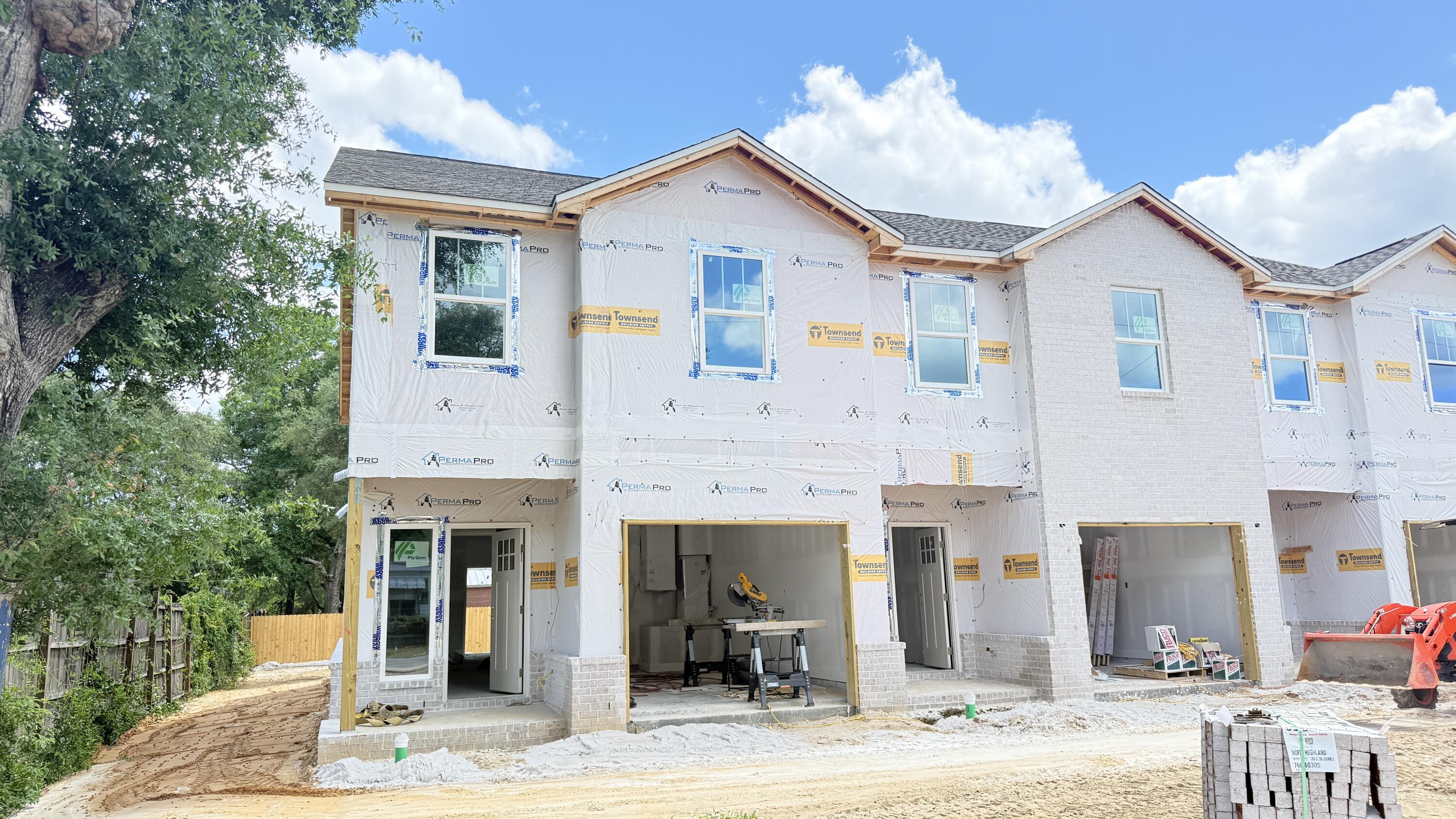 BRAND NEW END-UNIT townhome conveniently close to Bases, Beaches & Shopping! 3 bedrooms, 2.5 baths and 1,554 square feet of beautifully designed living space with NO HOA!  Builder is offering $12,000 in ''ANY WAY'' money that can be used toward closing costs and/or an interest rate buy-down! Built with impact glass windows for added storm protection and potential insurance savings, this spacious open-concept home features a large living and dining area, attached 1-car garage, half bath, and a stylish kitchen complete with stunning quartz countertops, stainless steel appliances including a refrigerator with ice maker, smooth-top range, built-in microwave, quiet dishwasher, breakfast bar seating, and dining area. Upstairs you'll find a generous primary suite with private sitting area, walk-in closet, and en-suite bath, along with two additional bedrooms, a full guest bath, and convenient upstairs laundry. Washer and dryer are included! Luxury Vinyl Plank flooring will be everywhere except the two guest bedrooms and the stairway.  Relax and entertain on the back patio overlooking the large 134-foot-deep Privacy Fenced backyard. Thoughtfully designed with comfortable room sizes, great storage, and modern finishes throughout--call today to schedule your private showing!  Projected completion is the end of July.