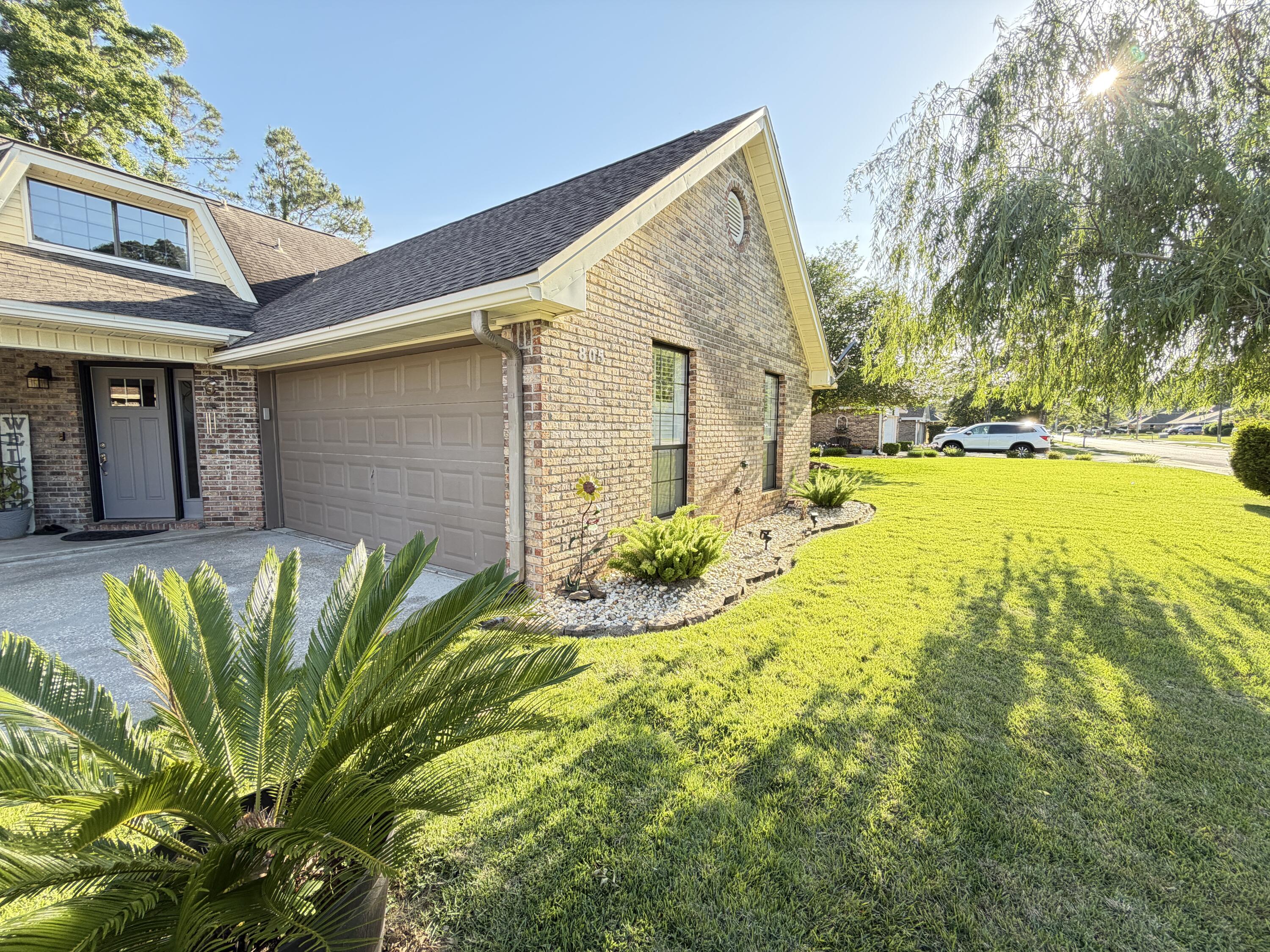 PRICE REDUCTION! Major updates already completed, including a 2023 HVAC, 2020 water heater, and 2017 roof. This is one of those homes you truly have to experience in person to appreciate--the natural light, spacious layout, and meticulous condition create a feeling that photos simply can't capture.

Located in desirable Overbrook with NO HOA, this brick home sits on approximately 0.23 acres and offers a large fenced backyard with no rear neighbors, a wide gate for RV or boat storage, lush green grass, and extended driveway parking.

Inside, vaulted ceilings and an open staircase create an airy feel, while the living room features tile flooring, a natural stone fireplace, and access to the enclosed Florida room overlooking the backyard. The kitchen includes granite countertops, updated fixtures, and a pass-through opening that connects the living and dining areas while maintaining defined spaces.

The first-floor primary suite and half bath provide convenience, and every bedroom includes a walk-in closet. Additional features include a dedicated laundry room with built-in wall niche storage, a smart security system on doors and windows, underground utilities, sidewalks throughout the neighborhood, a two-car garage, and plenty of storage.

Conveniently located between Eglin AFB and Hurlburt Field with easy access to local beaches, shopping, dining, and recreation.