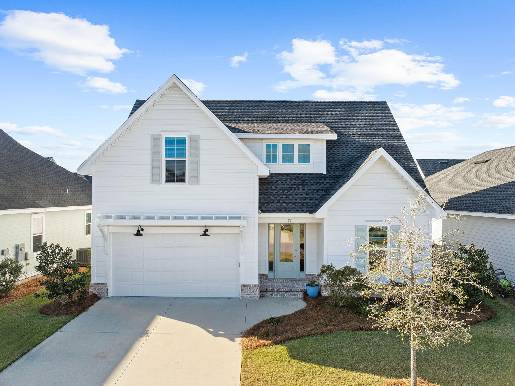 Located in the Stillwater phase of WaterSound Origins, 28 Conifer Court features the Draper floorplan by Huff Homes, which is one of the most requested layouts in the community. The home sits near the neighborhood's newest road access point, offering easy in-and-out convenience from day one. The primary suite is on the main floor, with three additional bedrooms and a loft upstairs, giving you flexible space for guests, family, or a dedicated home office. Fresh trim paint throughout keeps everything light and crisp, letting the home's natural brightness do the work. The kitchen is built for how people actually live, featuring a large center island, quartz countertops, Bosch stainless appliances, and a pantry. It opens directly into the dining and living areas, so the flow from cooking to entertaining is seamless. Out back, a 6-foot privacy fence encloses the full yard, and a screened porch extends your living space into the outdoors without the bugs. The home is vacant and move-in ready. WaterSound Origins amenities include a resort-style pool, pickleball and tennis courts, a fitness center, and access to Lake Origins for kayaking and paddleboarding, all within a thoughtfully planned, non-rental community.