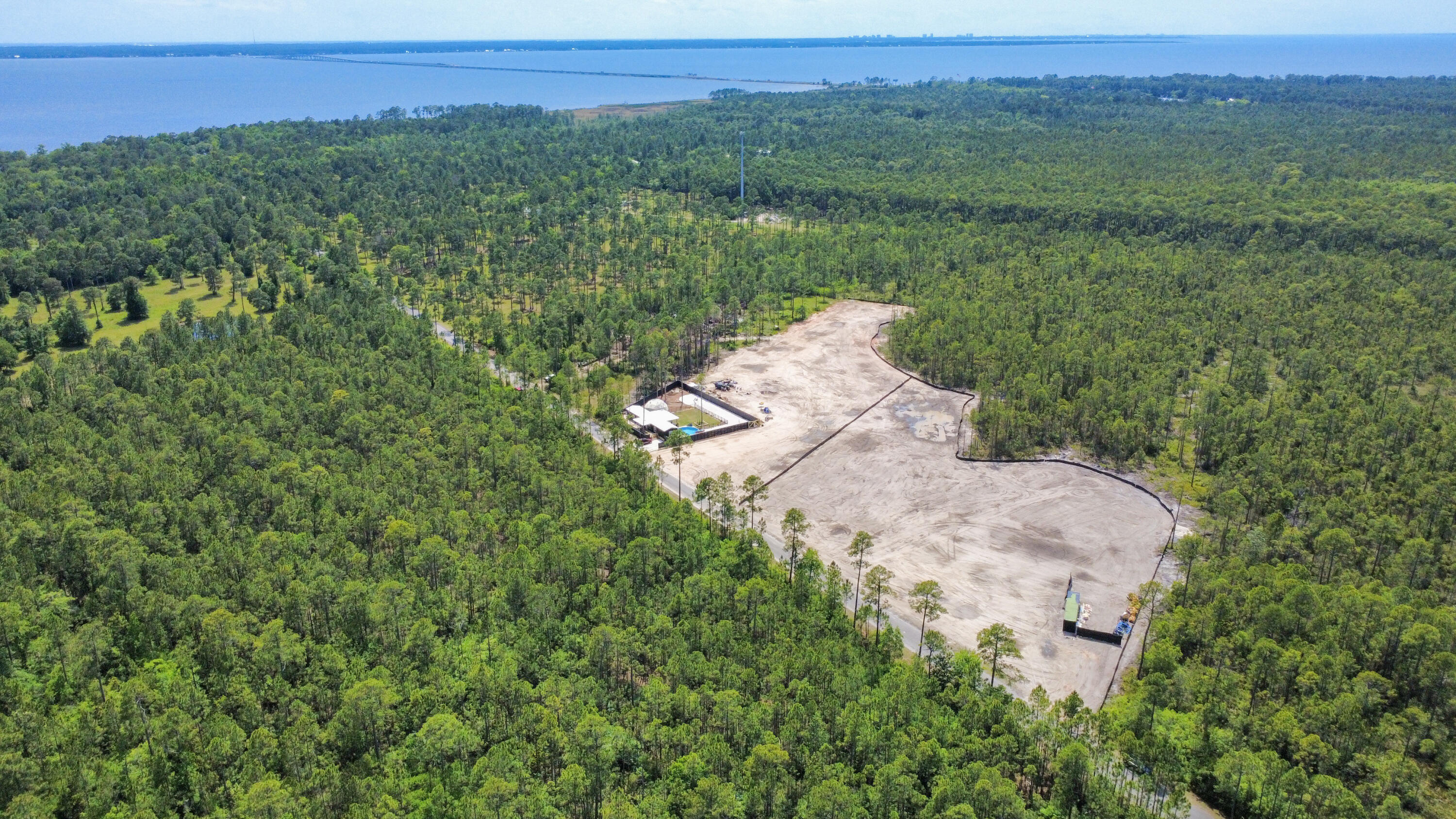 Seller Financing Available to be negotiated!
Cleared land, ready to build! Electric, City water & sewer available! 4.5 Acres located just North of the 331 Bridge in Walton County. Conveniently located 4 miles from Grady Brown Park with a boat launch & Bay access, and only 11 miles to the nearest beach access on Northwest Florida's most beautiful beaches! Freeport's 331 corridor is rapidly growing with restaurants, commercial & retail property, including Walmart already under development. This property is zoned Rural Residential/Rural Village (2 units per acre). Survey, engineer report , and wetlands study completed. Buyer may choose to continue A 9 Townhome development or build to suit!