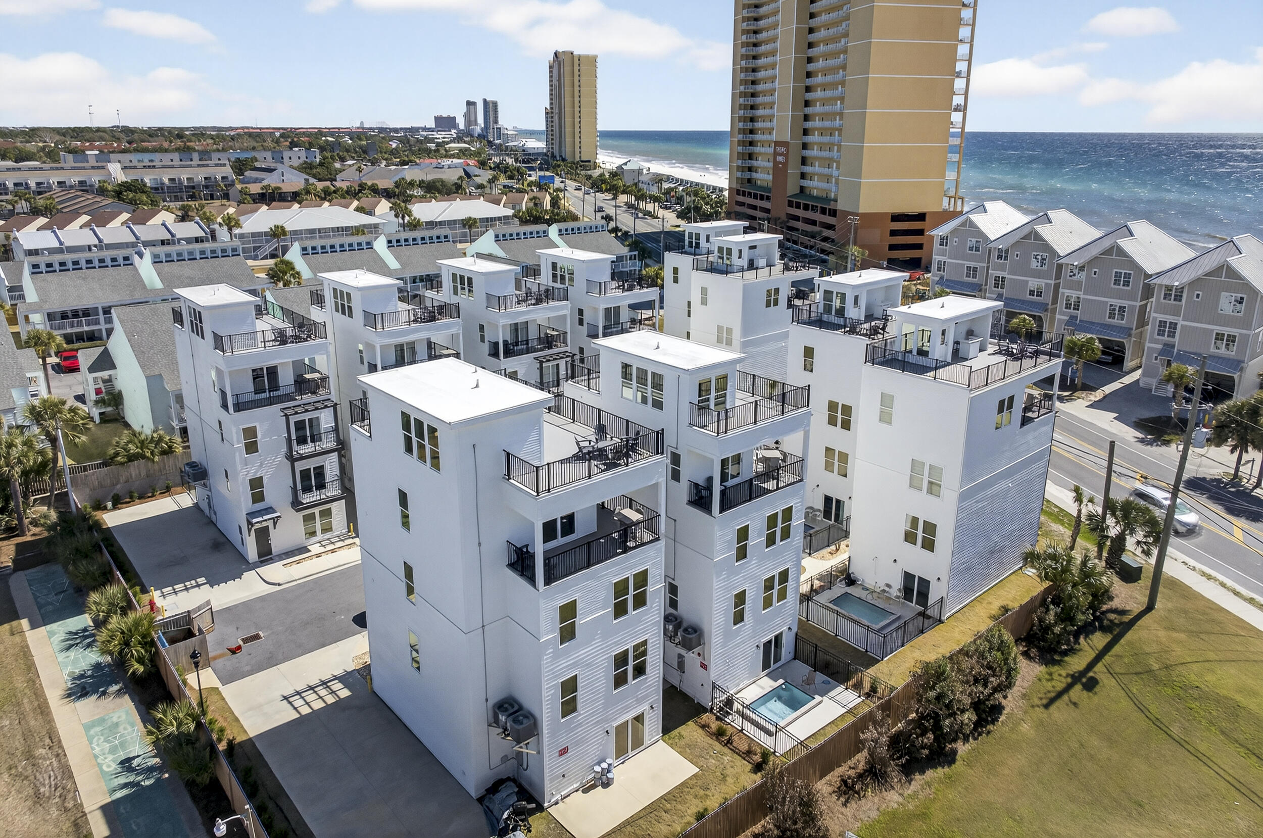 A rare offering in Panama City Beach, Laguna Villas is a private enclave of ten gulf-view luxury residences, presenting an exclusive opportunity to acquire a turnkey boutique collection in a proven short-term rental market. Each 5BR/5.5BA villa features modern finishes, private plunge pools, rooftop terraces, and direct access to public beach access 72 and 73, all designed to maximize guest appeal and premium nightly rates. Located just minutes from Pier Park, world-class dining along 30A, and popular Gulf Coast attractions, these gulf-view vacation rentals offer the perfect blend of luxury, exclusivity, and strong income potential. This fully integrated collection of ten residences is a rare investment opportunity in one of Florida's top-performing beach rental markets.